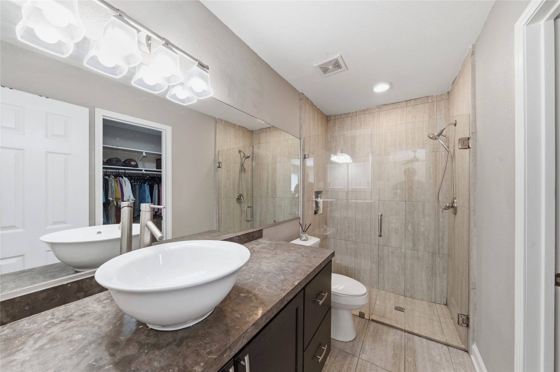 2211 Kinbrook Drive, Houston, TX 77077 Step into your beautifully updated primary bathroom.