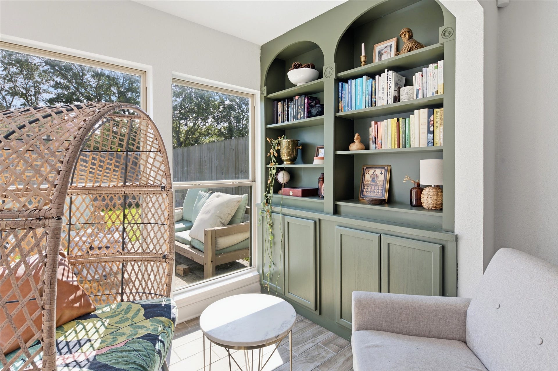 2211 Kinbrook Drive, Houston, TX 77077 Versatile sunroom or flex space directly off the main living area with beautiful built-in shelving.