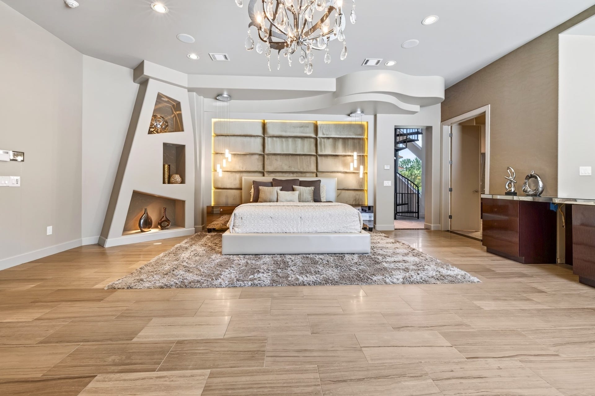 Contemporary luxury colors, and natural light fill the primary.