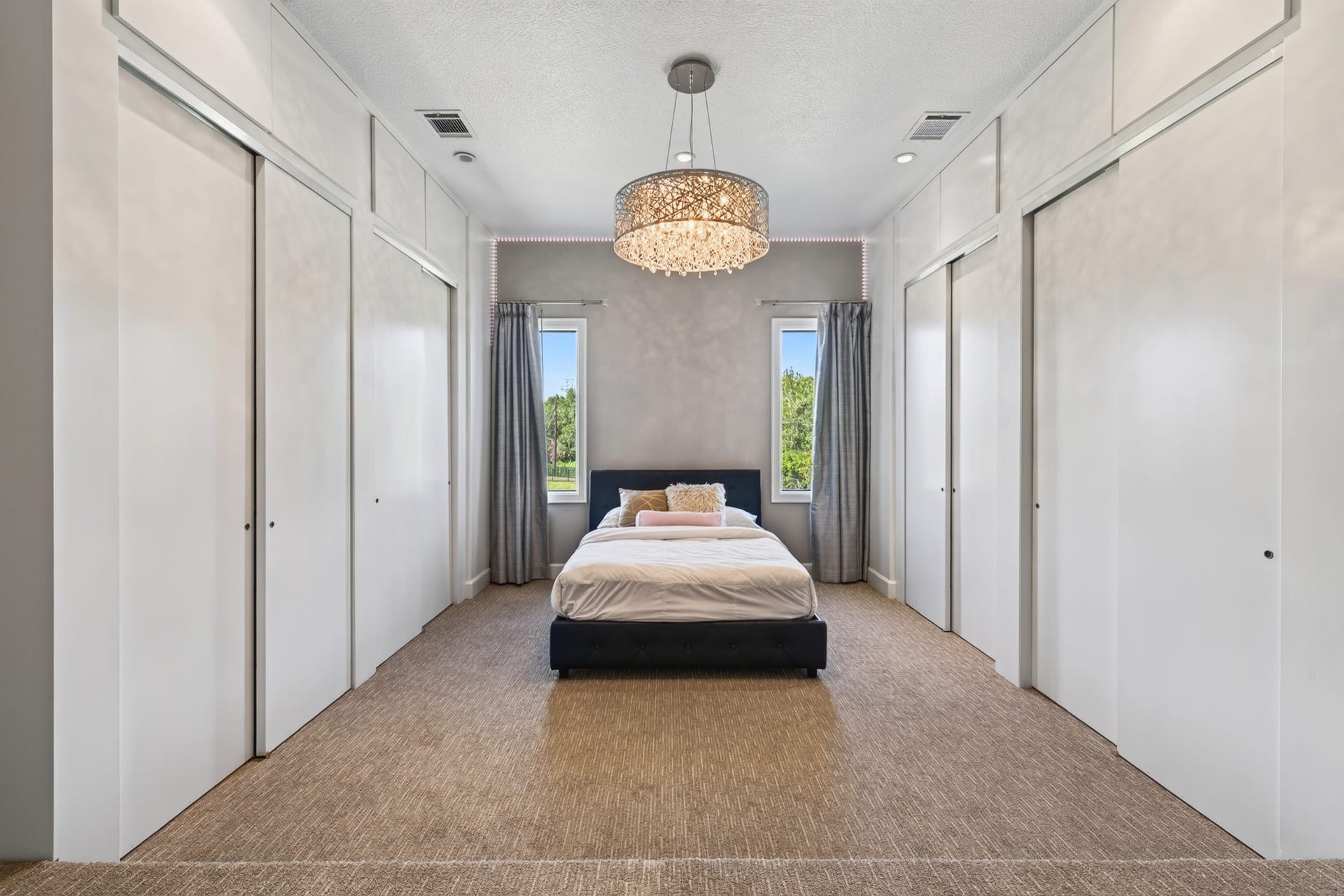 Generously proportioned bedroom suite features warm contemporary finishes and abundant natural light.