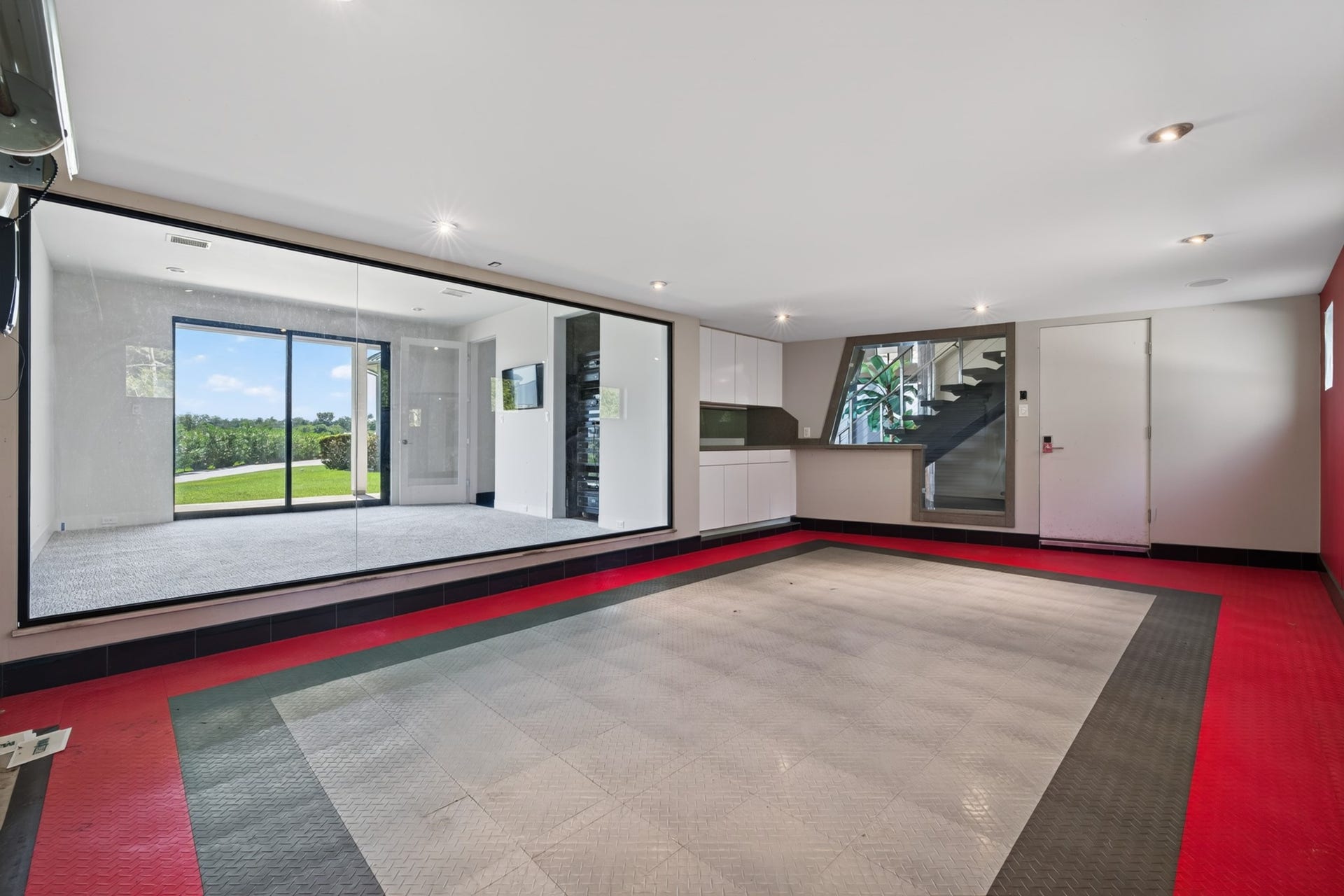 Wide motor court provides an impressive approach to the residence.