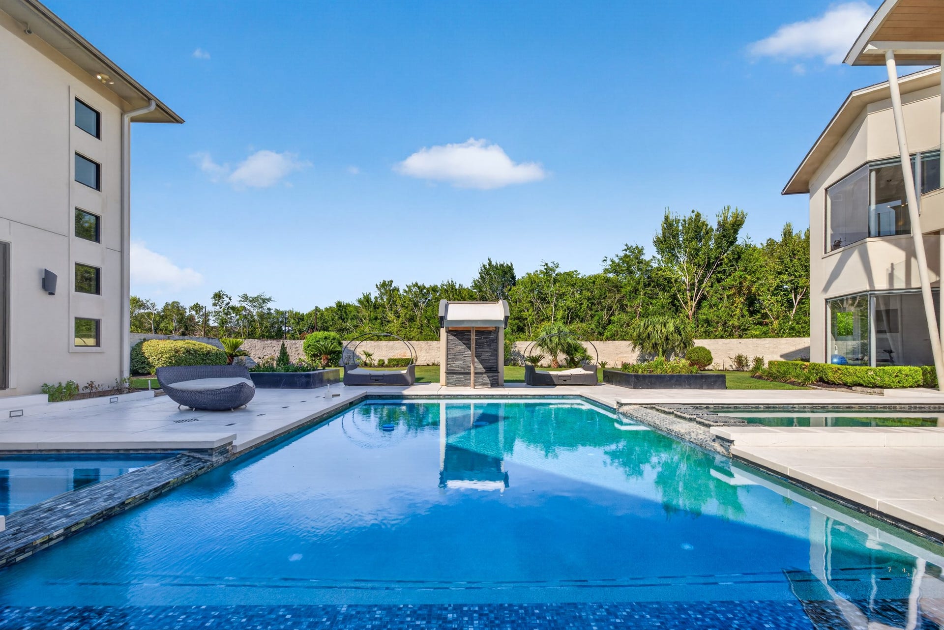 Sparkling resort-style pool provides a spectacular backdrop for outdoor entertaining.