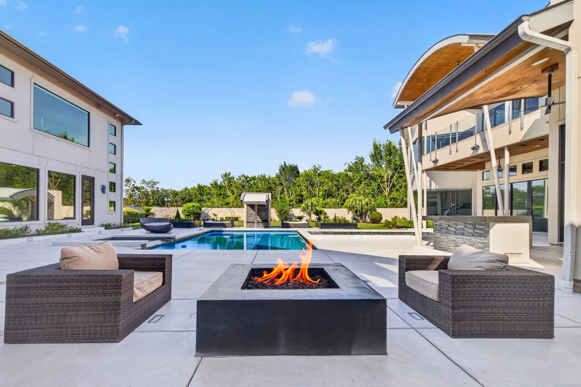 Pool and surrounding terraces offer multiple spaces for lounging, gathering and entertaining.