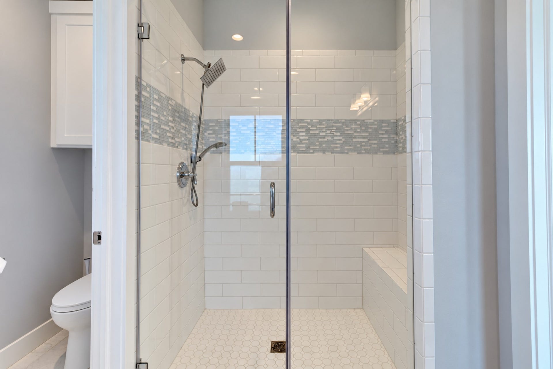 3802 Abalone Road, Galveston, TX 77554 The primary bathroom has an oversized tile surround shower with glass enclosure.