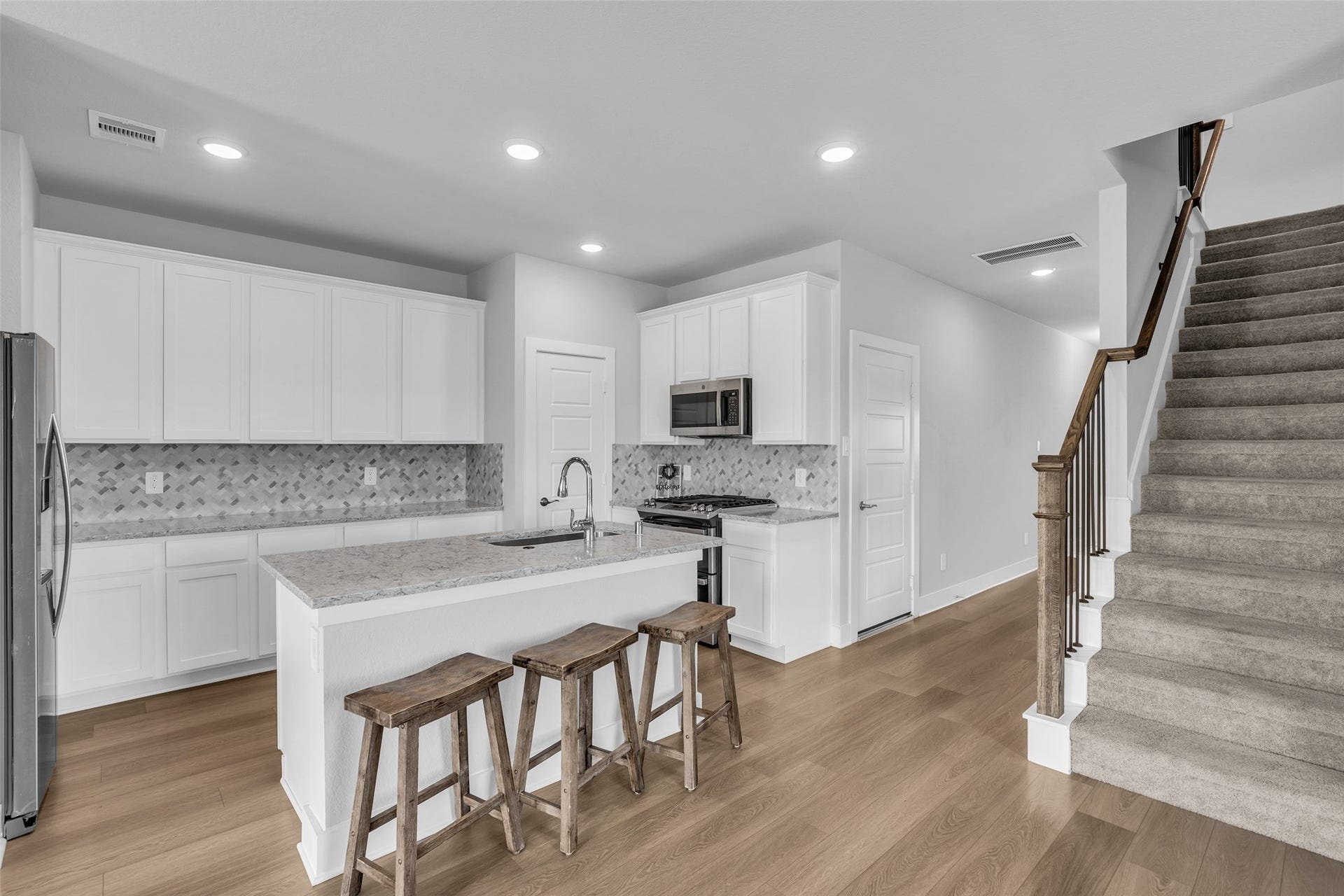 207 Alder Laurels Cove, Magnolia, TX 77354 Kitchen open to dining area and living space