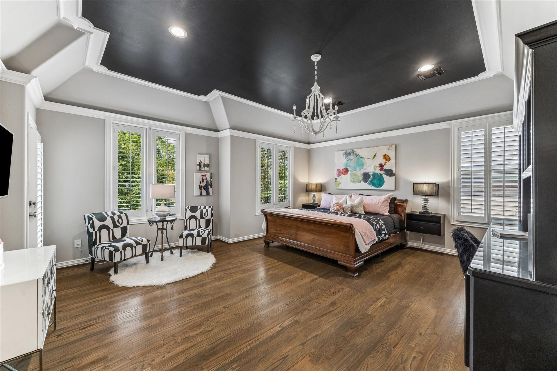 One of four spacious secondary bedrooms, this one with room for a sitting area and access to the front balcony.