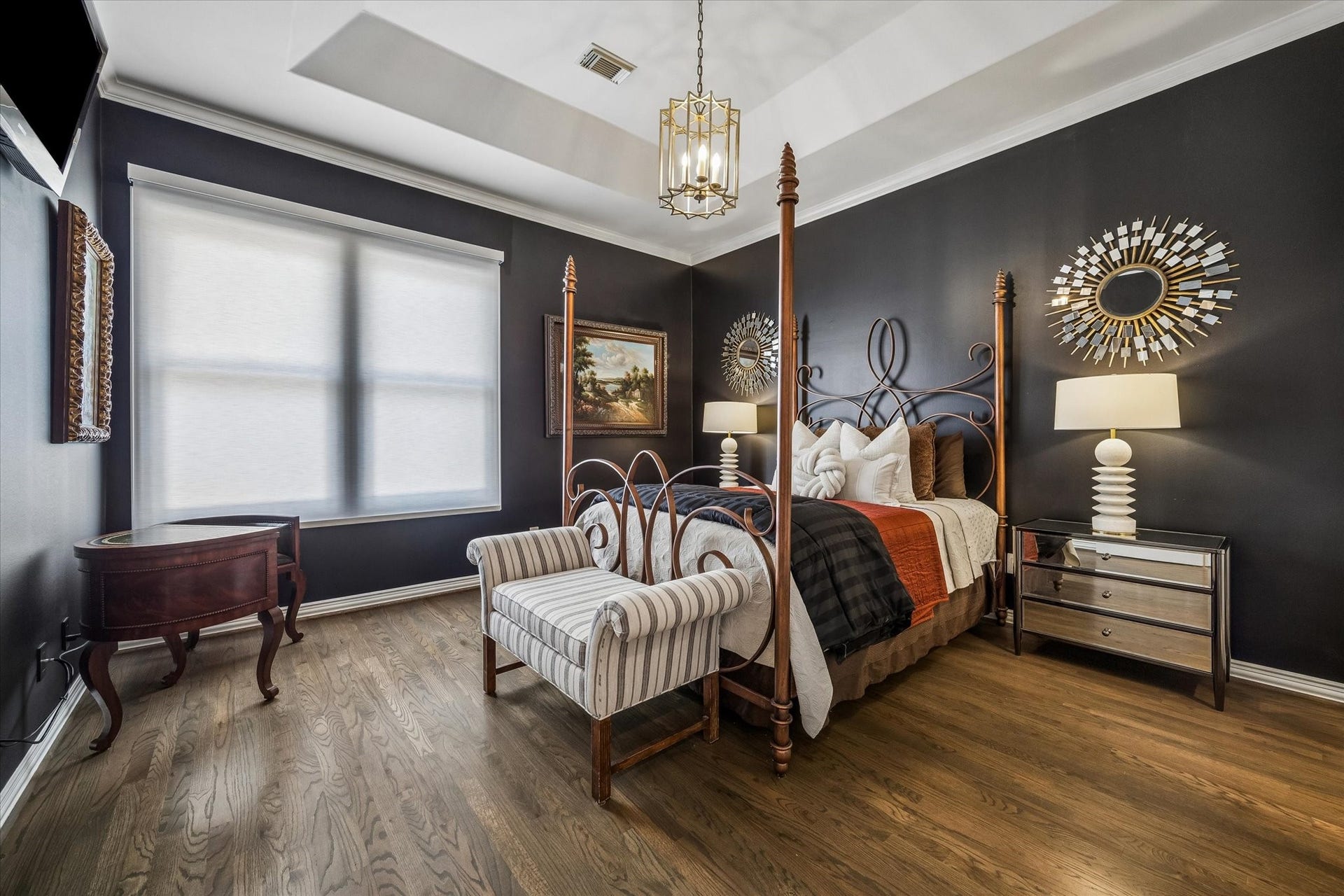 Each secondary bedroom has its own distinctive details, like the rich paint color and tray ceiling shown here.