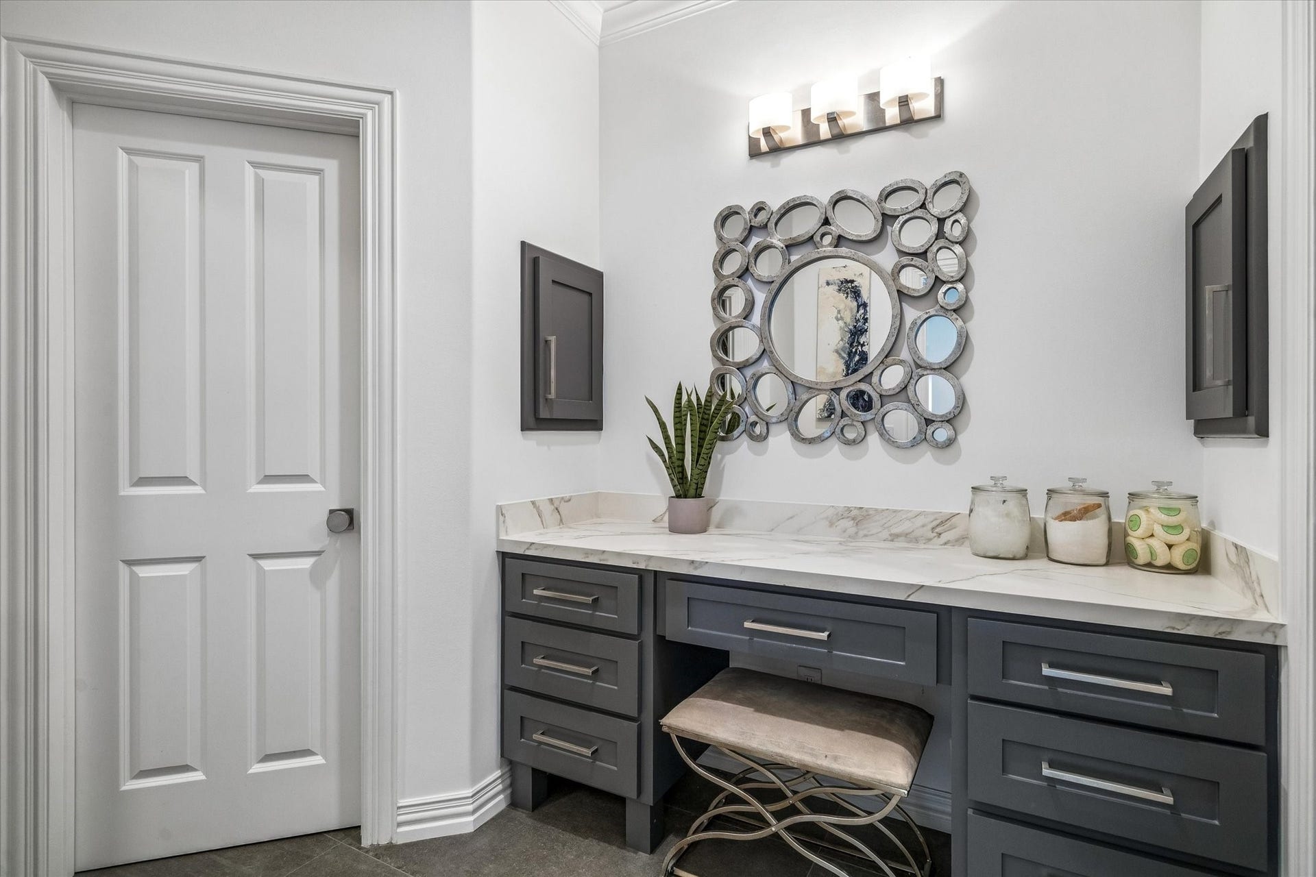 A dedicated vanity area at the entrance to the primary closet.