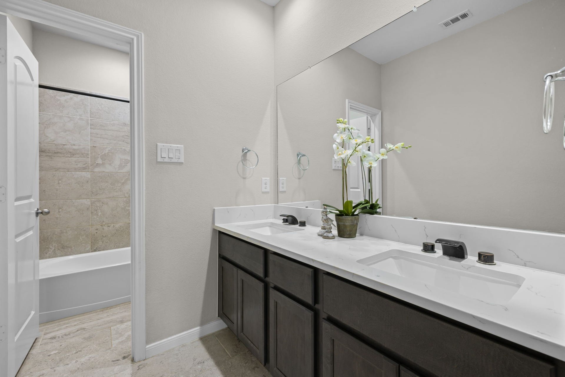 25615 Pinyon Hill Trail, Tomball, TX 77375 The hall bath has double sinks and separate wet area