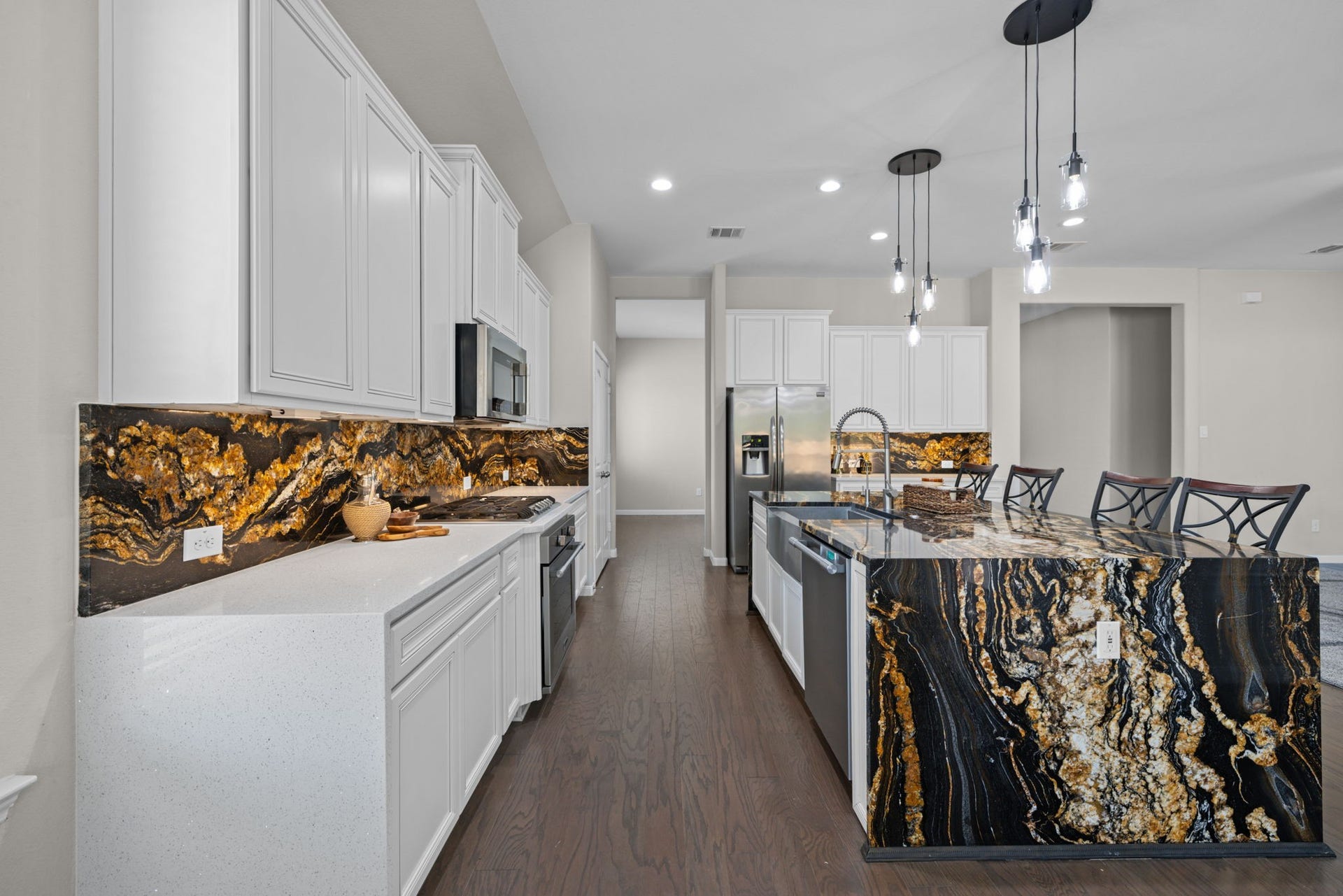 25615 Pinyon Hill Trail, Tomball, TX 77375 The stainless appliances include gas cook top and stainless farm house sink