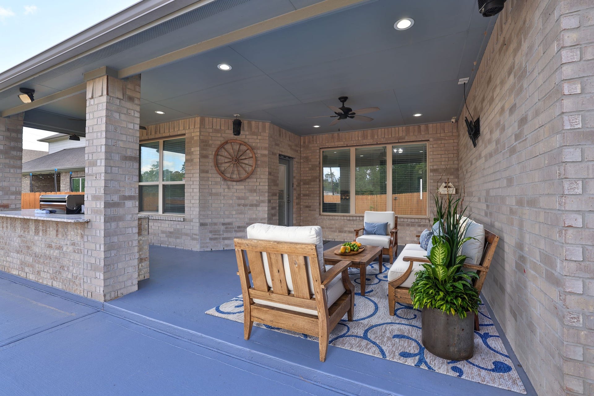 25615 Pinyon Hill Trail, Tomball, TX 77375 *virtually staged* You'll truly enjoy this extended covered patio with ceiling fan and recently painted concrete floor.
