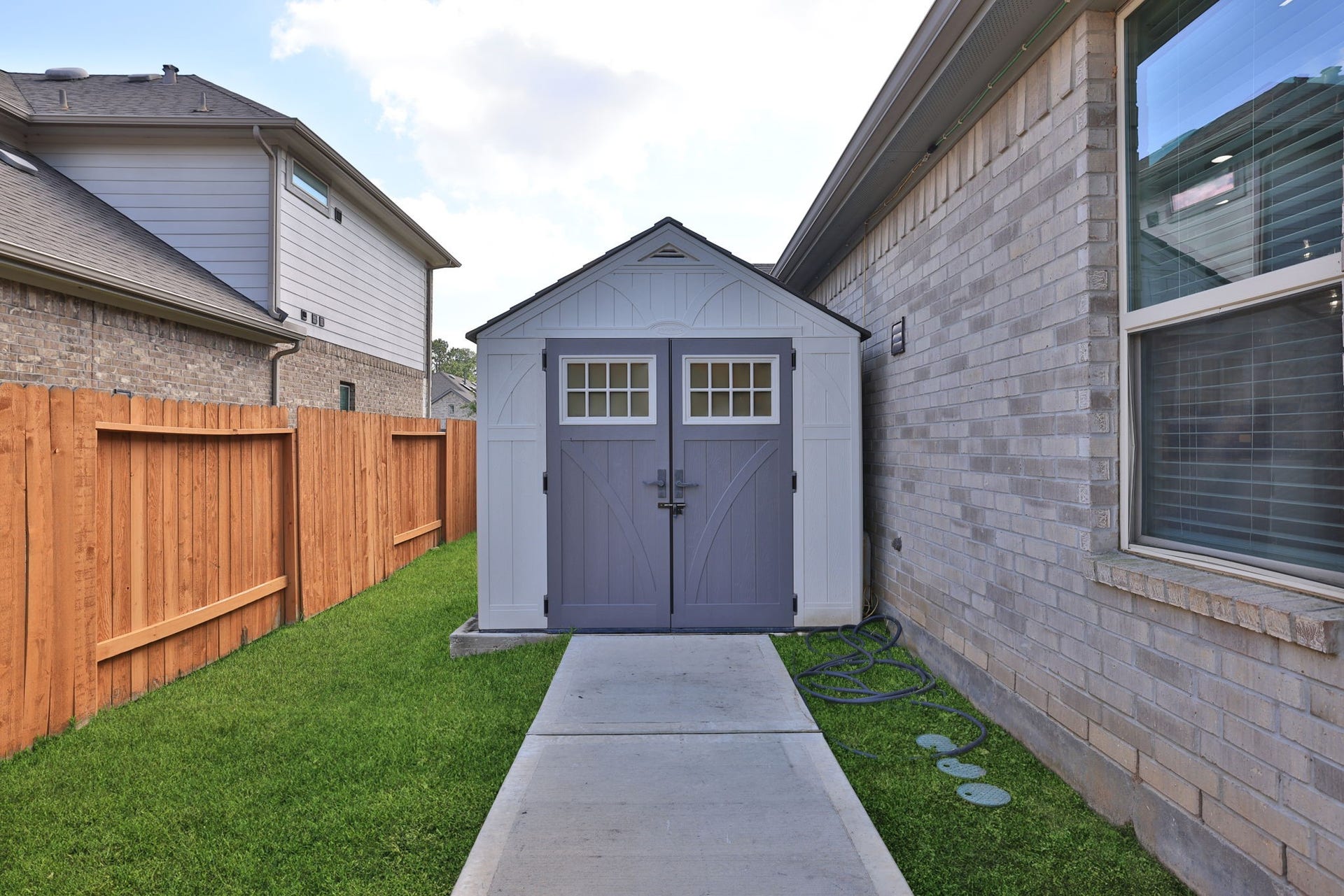 25615 Pinyon Hill Trail, Tomball, TX 77375 The shed has a concrete walk for easy use and is on a slab