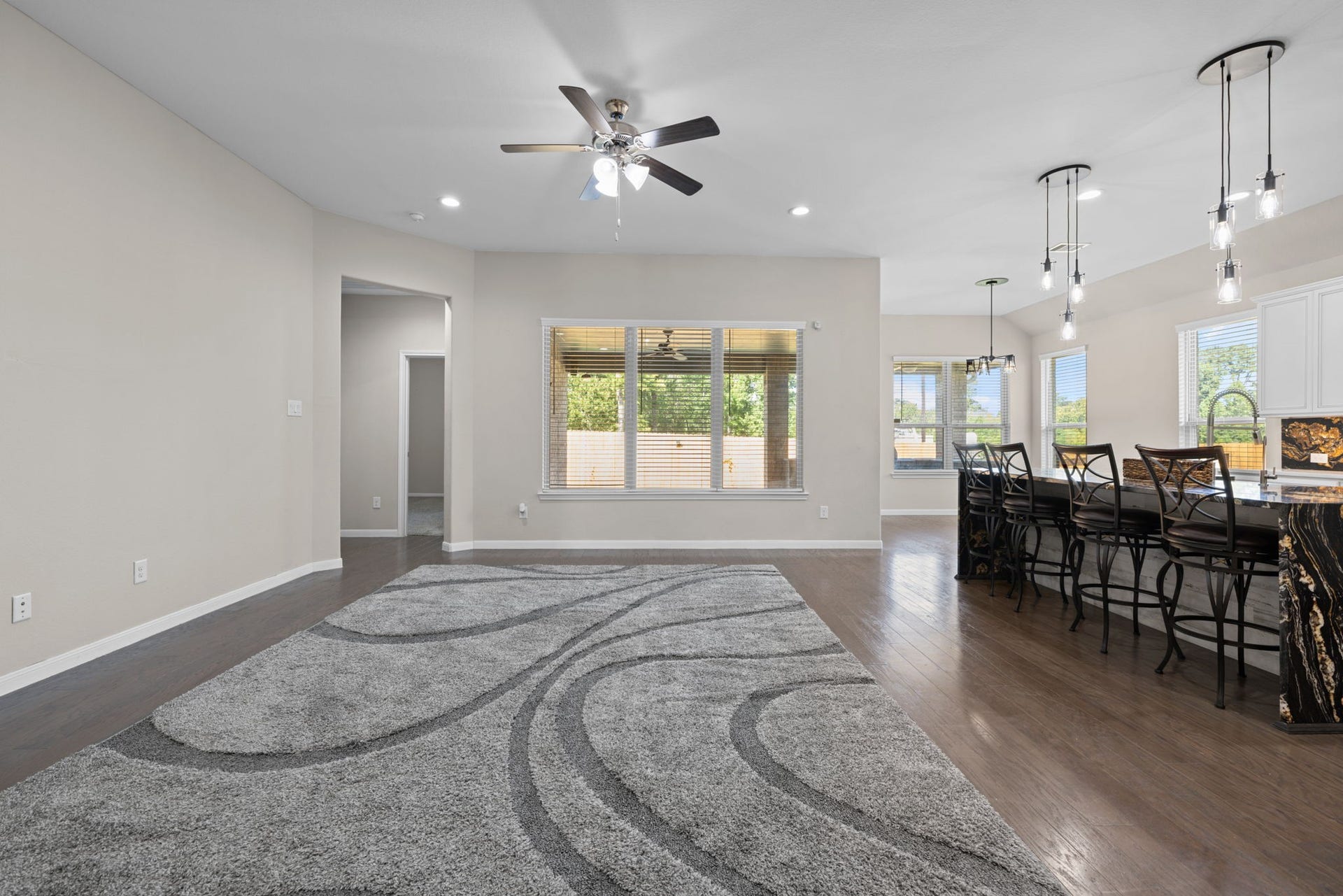 25615 Pinyon Hill Trail, Tomball, TX 77375 Such a spacious family room with high ceilings and great views out to the patio nad yard