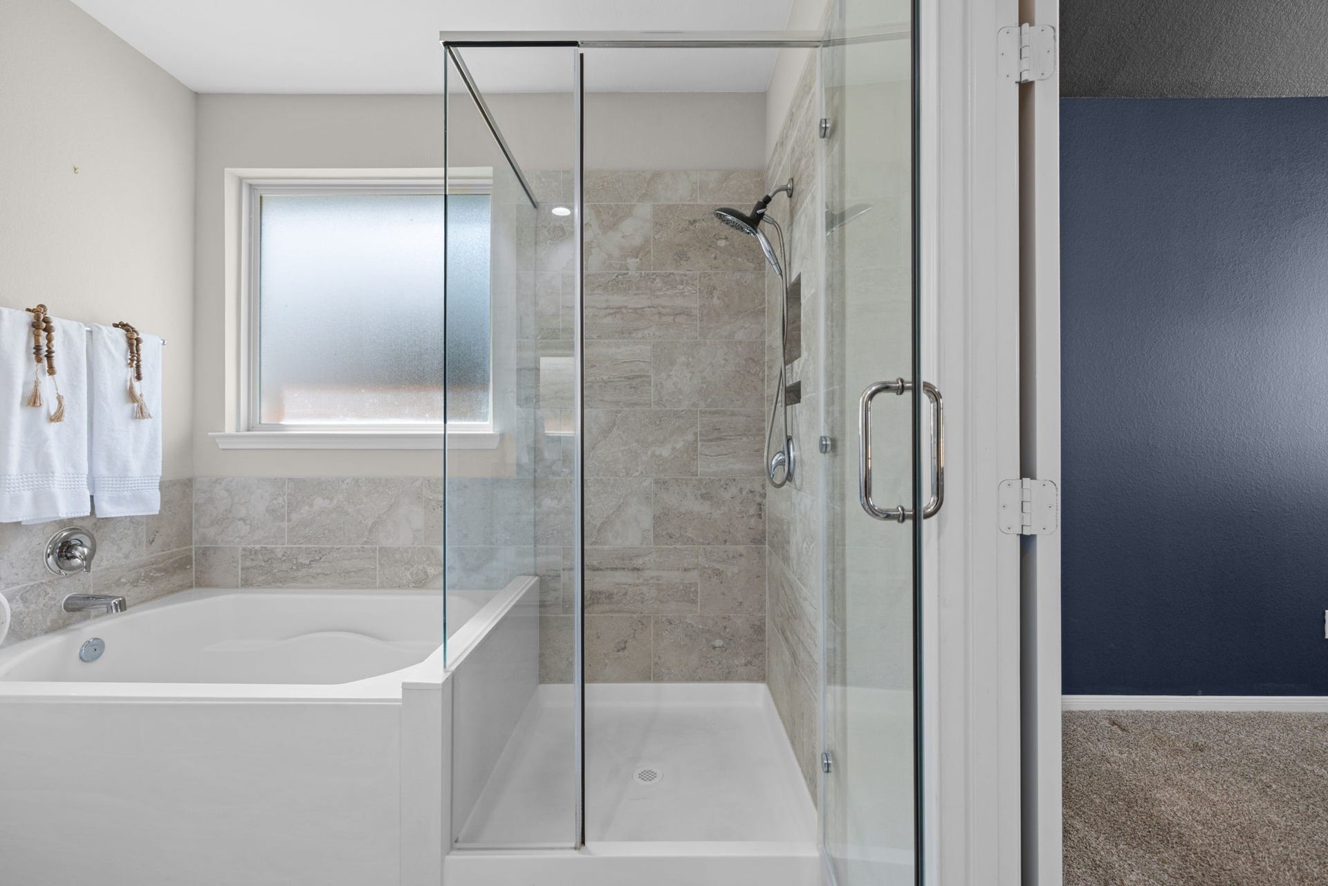25615 Pinyon Hill Trail, Tomball, TX 77375 There's separate tub and walk in shower with frameless glass