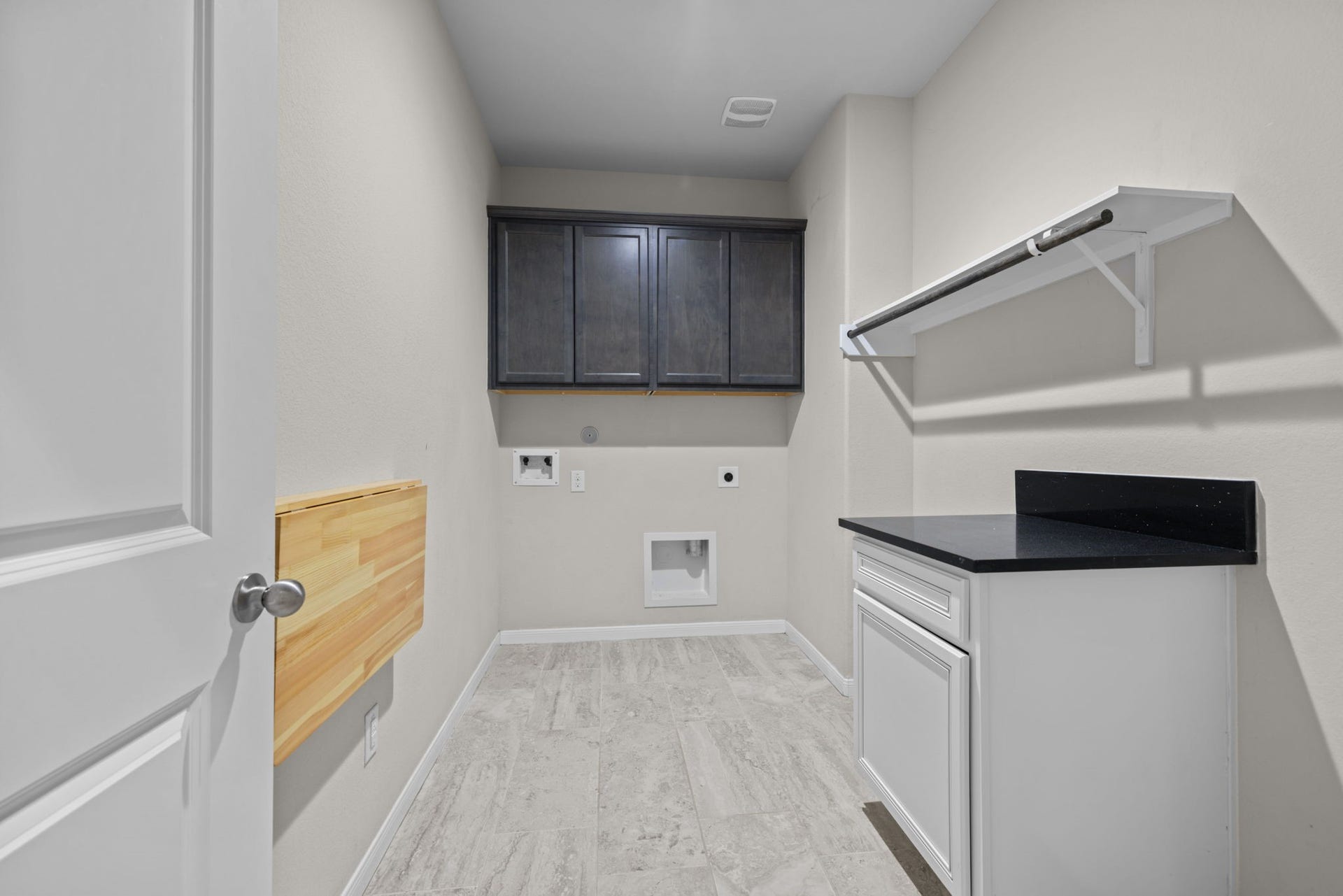 25615 Pinyon Hill Trail, Tomball, TX 77375 The laundry room is just next to the garage entry and drop zone. This is a large room with folding table and cabinets.