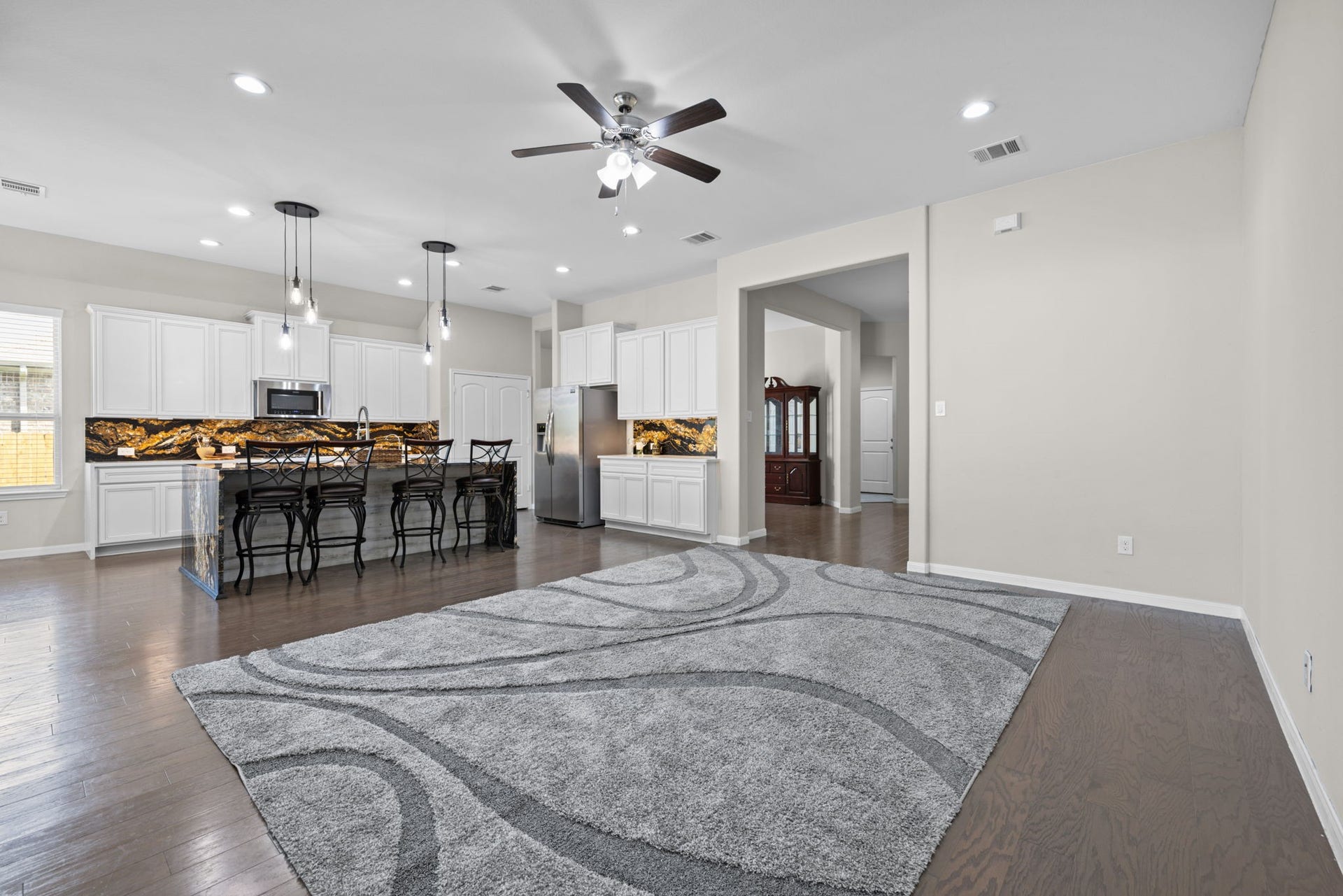 25615 Pinyon Hill Trail, Tomball, TX 77375 This area has plenty of room for your large furniture and TV. This space moves freely between the family room, kitchen and outdoor area so it's great for entertaining
