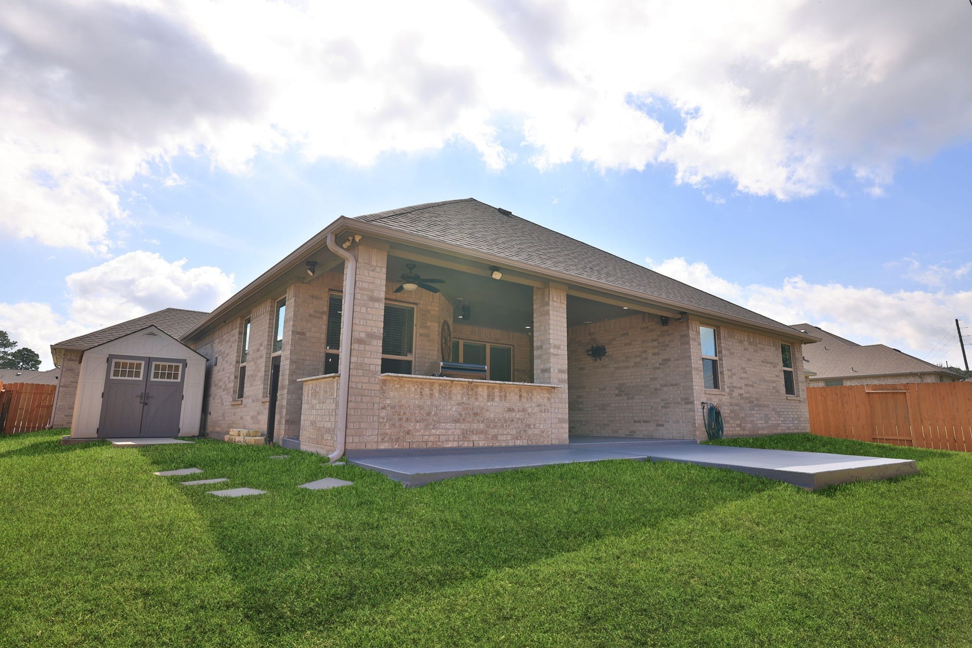 25615 Pinyon Hill Trail, Tomball, TX 77375 This all brick home is easy maintenance and the shed holds plenty of yard tools or garage overflow