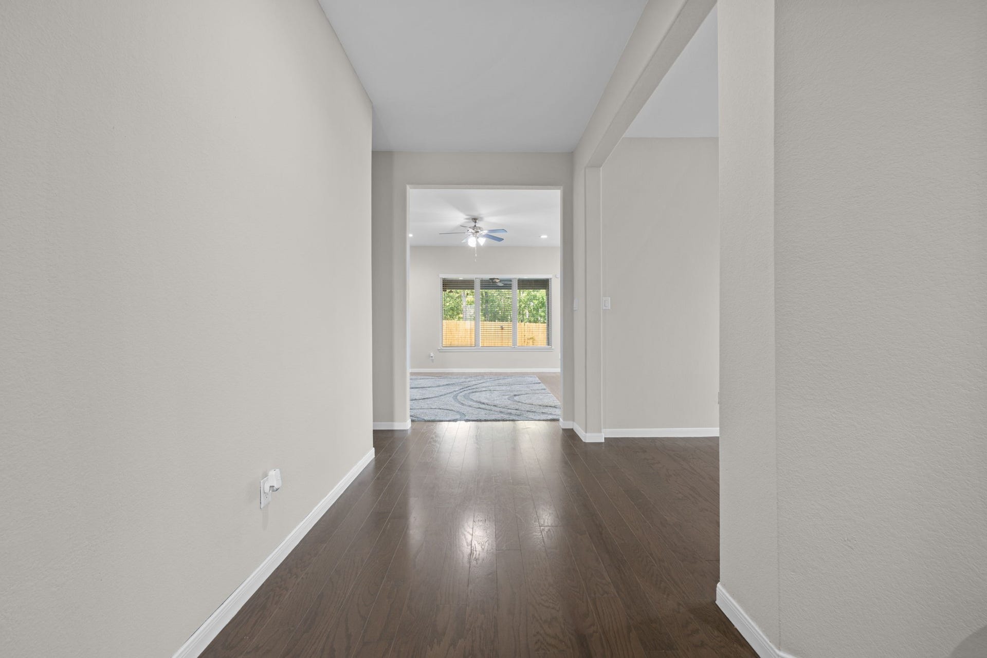 25615 Pinyon Hill Trail, Tomball, TX 77375 Looking from the front door down the wide foyer towards the family room area
