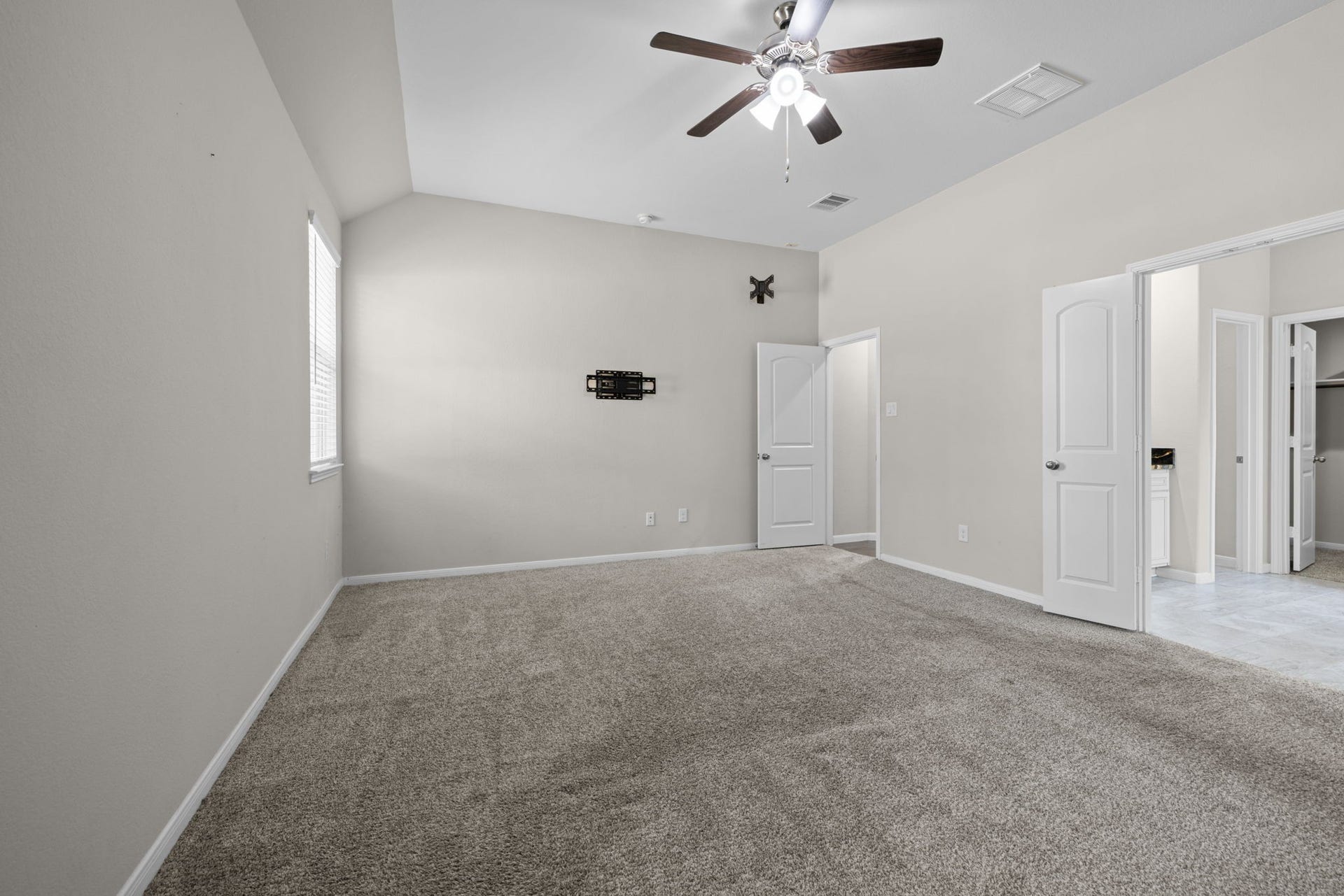 25615 Pinyon Hill Trail, Tomball, TX 77375 The spacious primary bedroom has high ceilings and ensuite bath