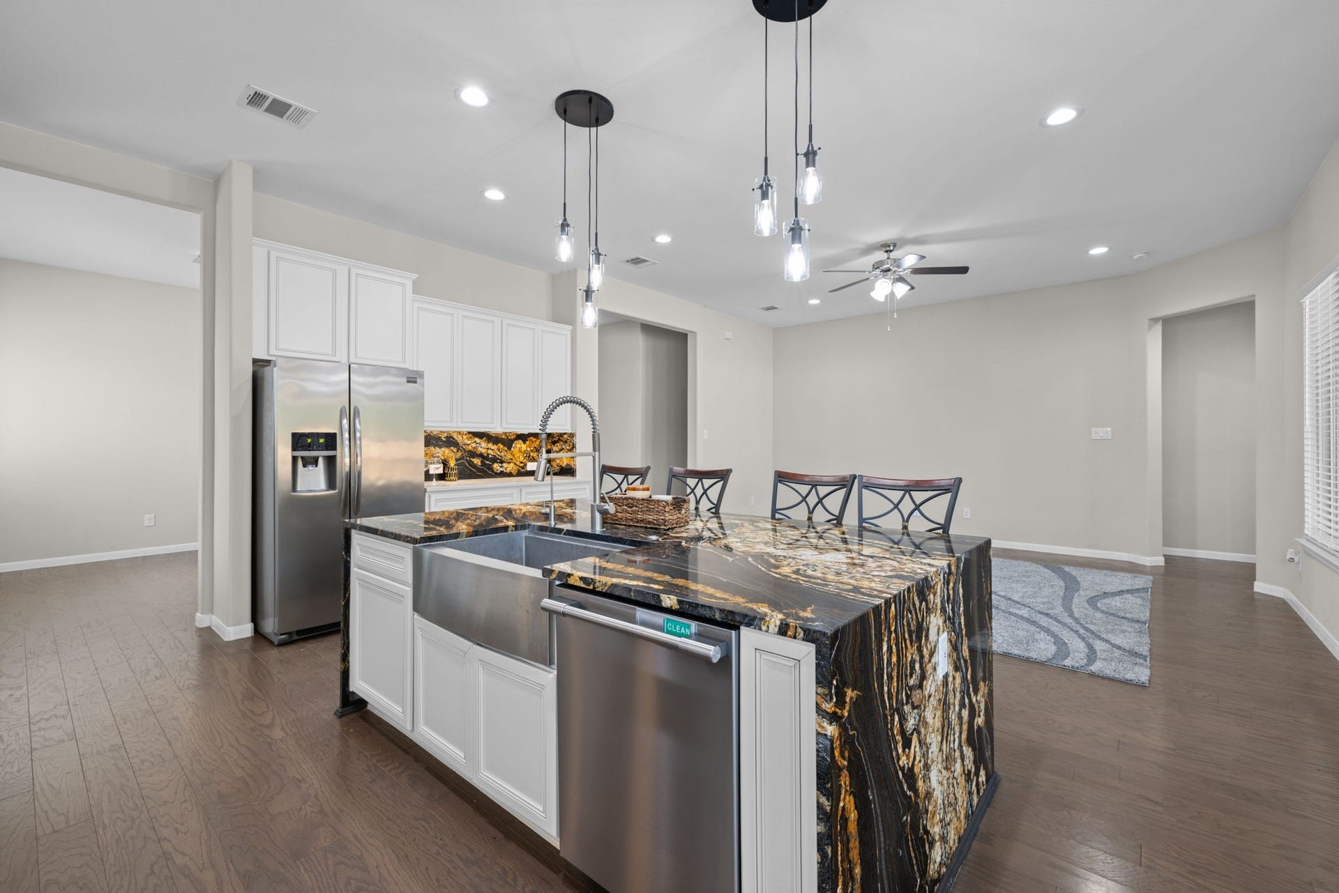 25615 Pinyon Hill Trail, Tomball, TX 77375 The pendant lights add a nice decorative touch while still giving soft lighting along with all the recessed lights