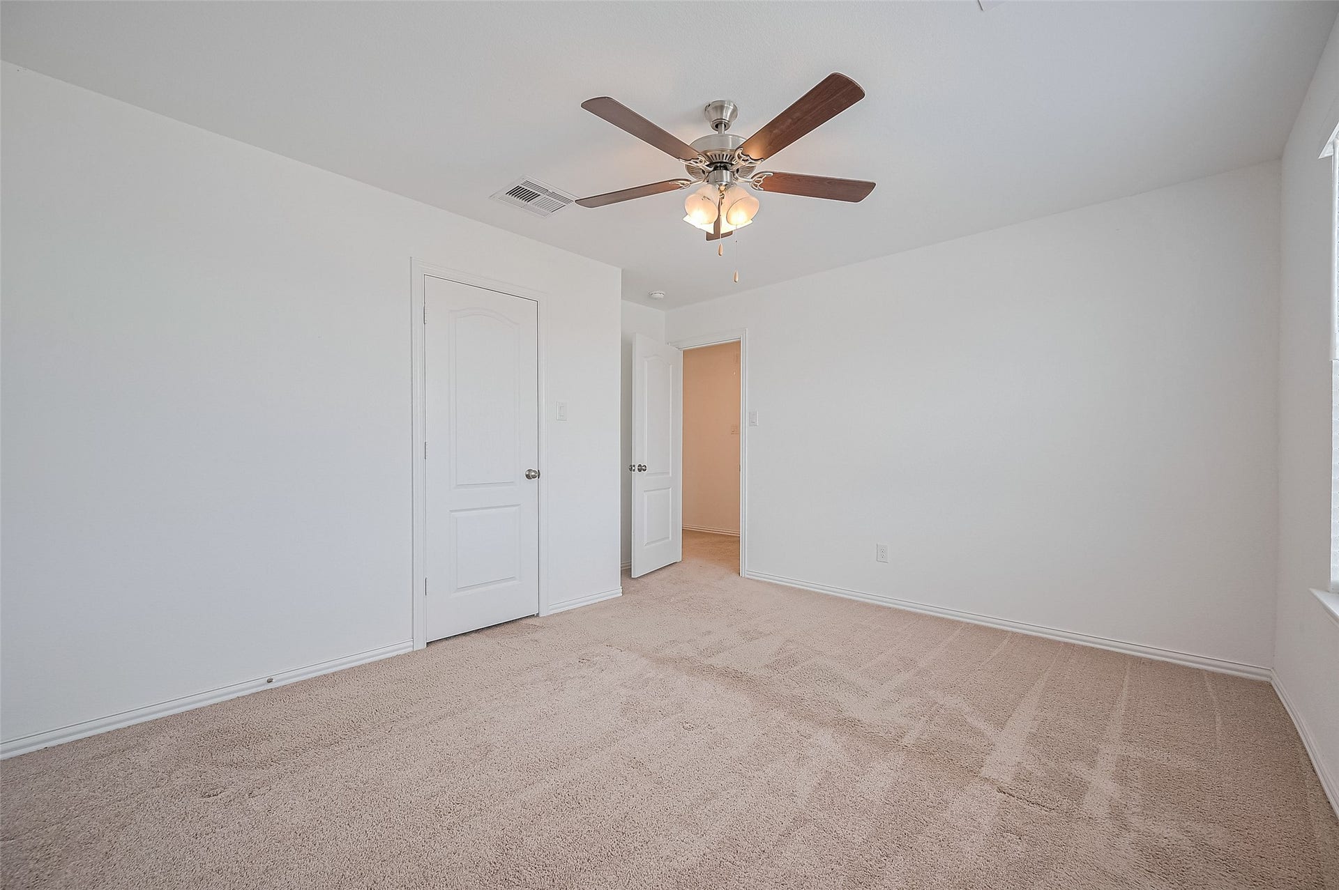 31326 Whitfield Court, Fulshear, TX 77441 Room includes a ceiling fan with lights, creating a bright and airy space.