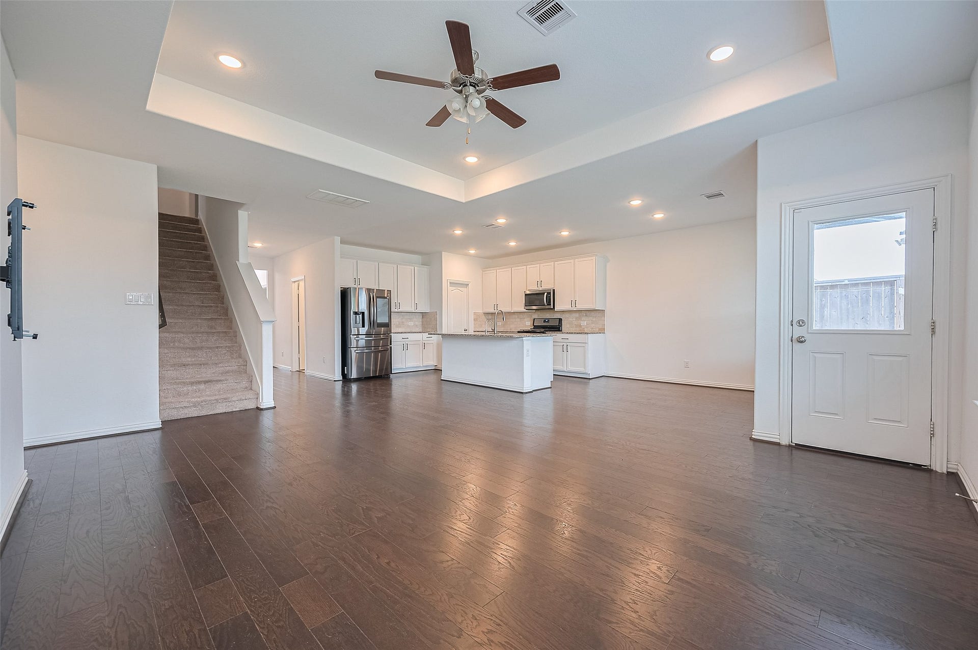 31326 Whitfield Court, Fulshear, TX 77441 Living room features a staircase leading to the upper floor.