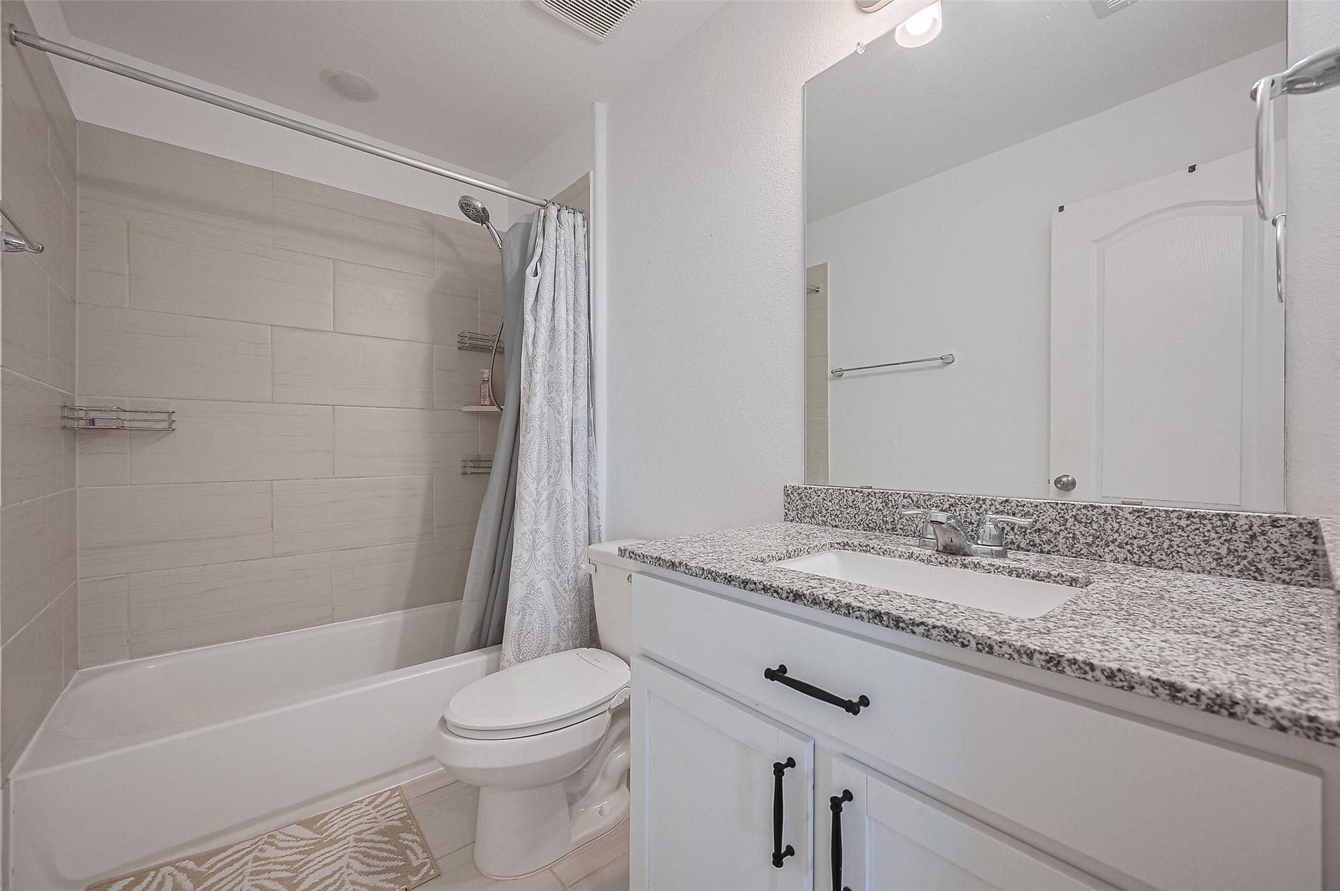 31326 Whitfield Court, Fulshear, TX 77441 Bathroom features a modern design with sleek white cabinetry.