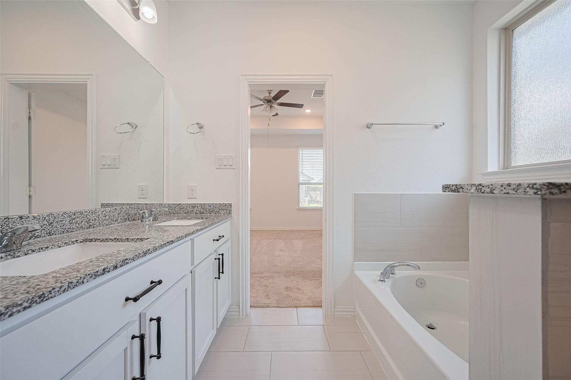 31326 Whitfield Court, Fulshear, TX 77441 Bright bathroom features a recessed lighting and a large mirror.