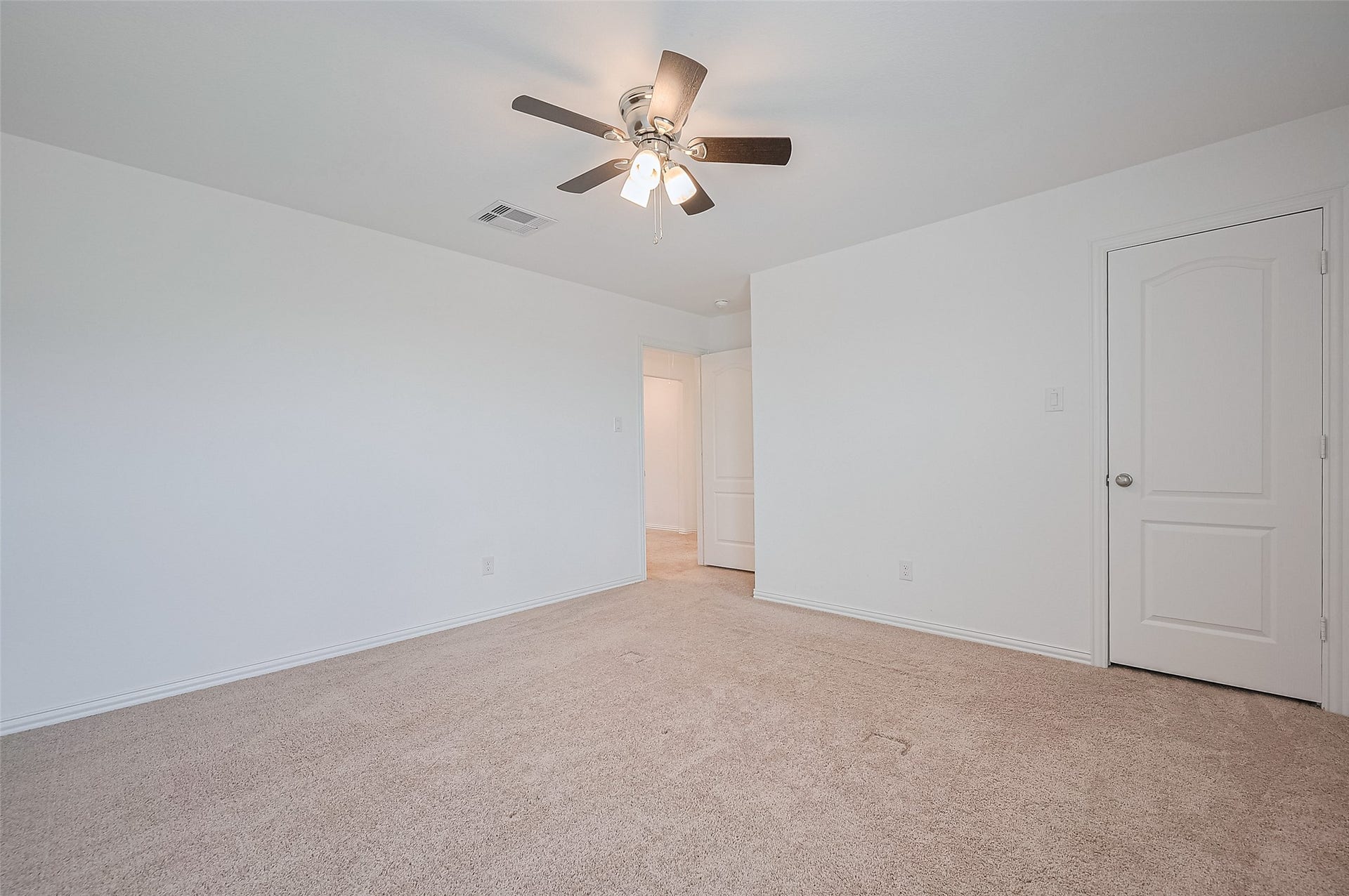 31326 Whitfield Court, Fulshear, TX 77441 Spacious room with a simple closet door and an additional door leading to bathroom.