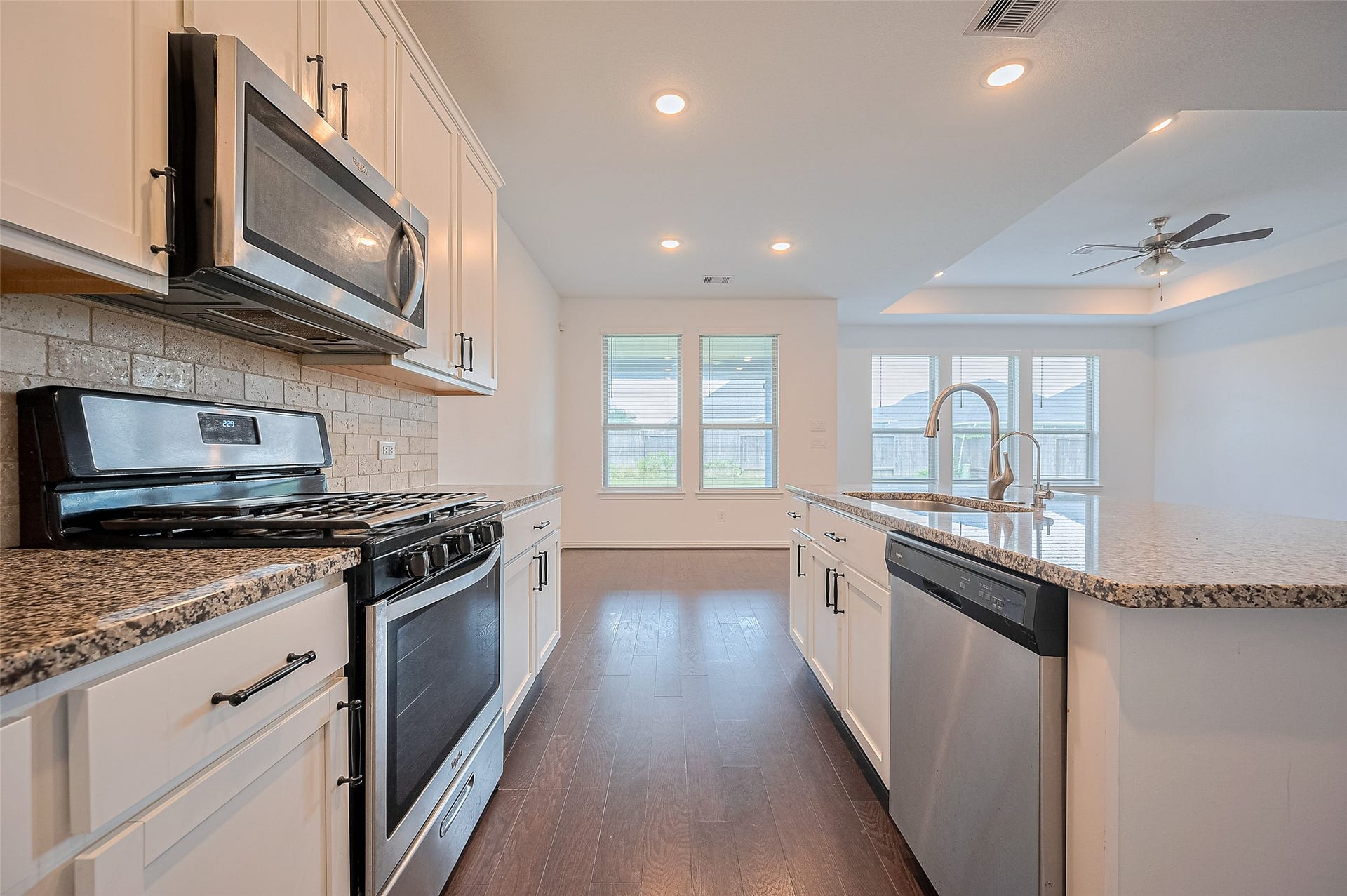 31326 Whitfield Court, Fulshear, TX 77441 Kitchen includes a built-in sink and stainless steel appliances.
