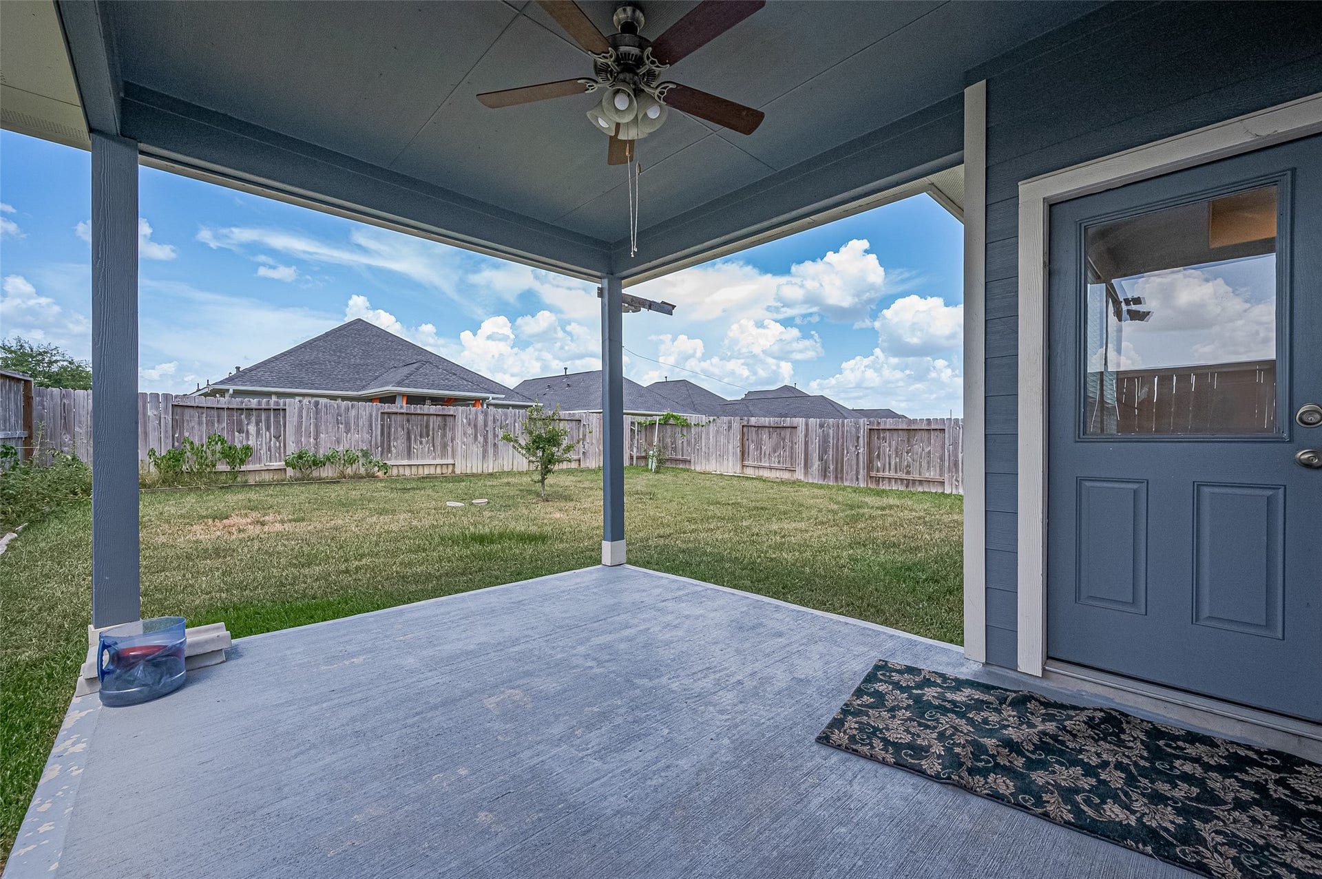 31326 Whitfield Court, Fulshear, TX 77441 Charming covered patio with a ceiling fan.