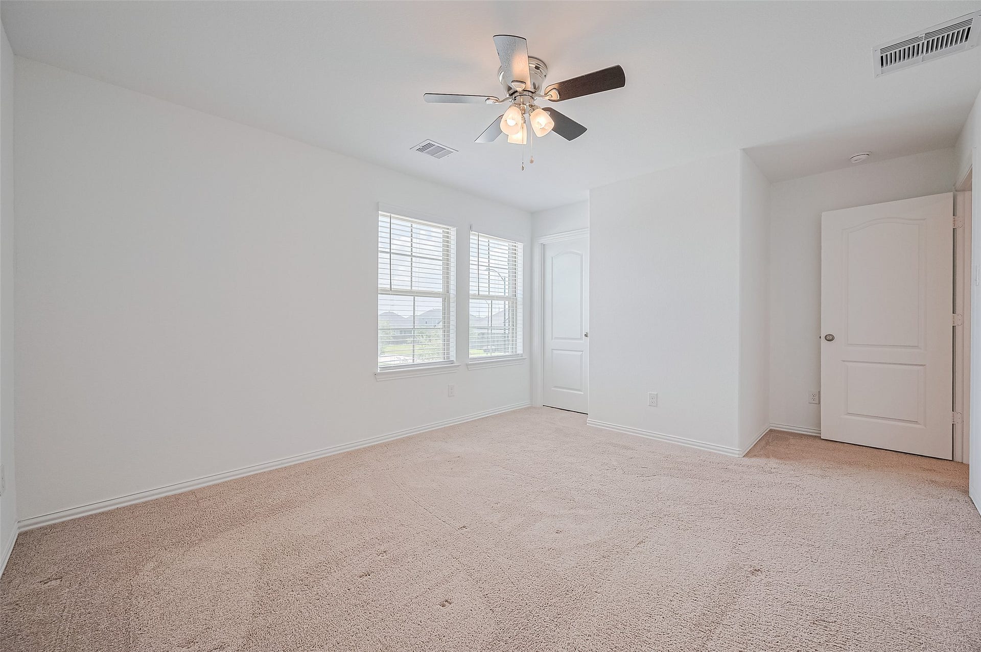 31326 Whitfield Court, Fulshear, TX 77441 Features a closet with a white door, perfect for a cozy and inviting space.