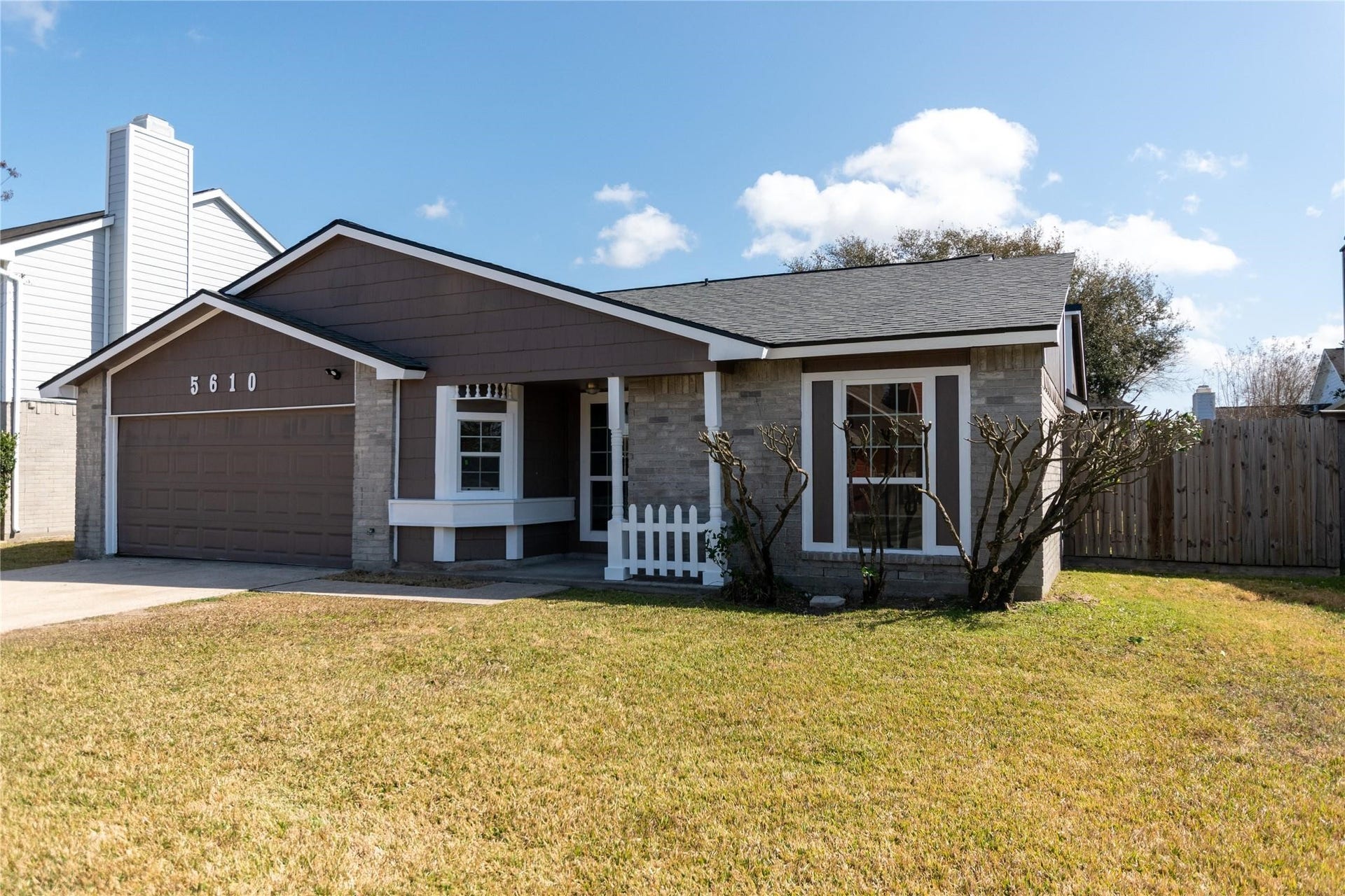 5610 Wallis Trail Court, Houston, TX 77049 Charming single-story home with a welcoming front porch, attached garage, and neatly landscaped yard, offering great curb appeal.