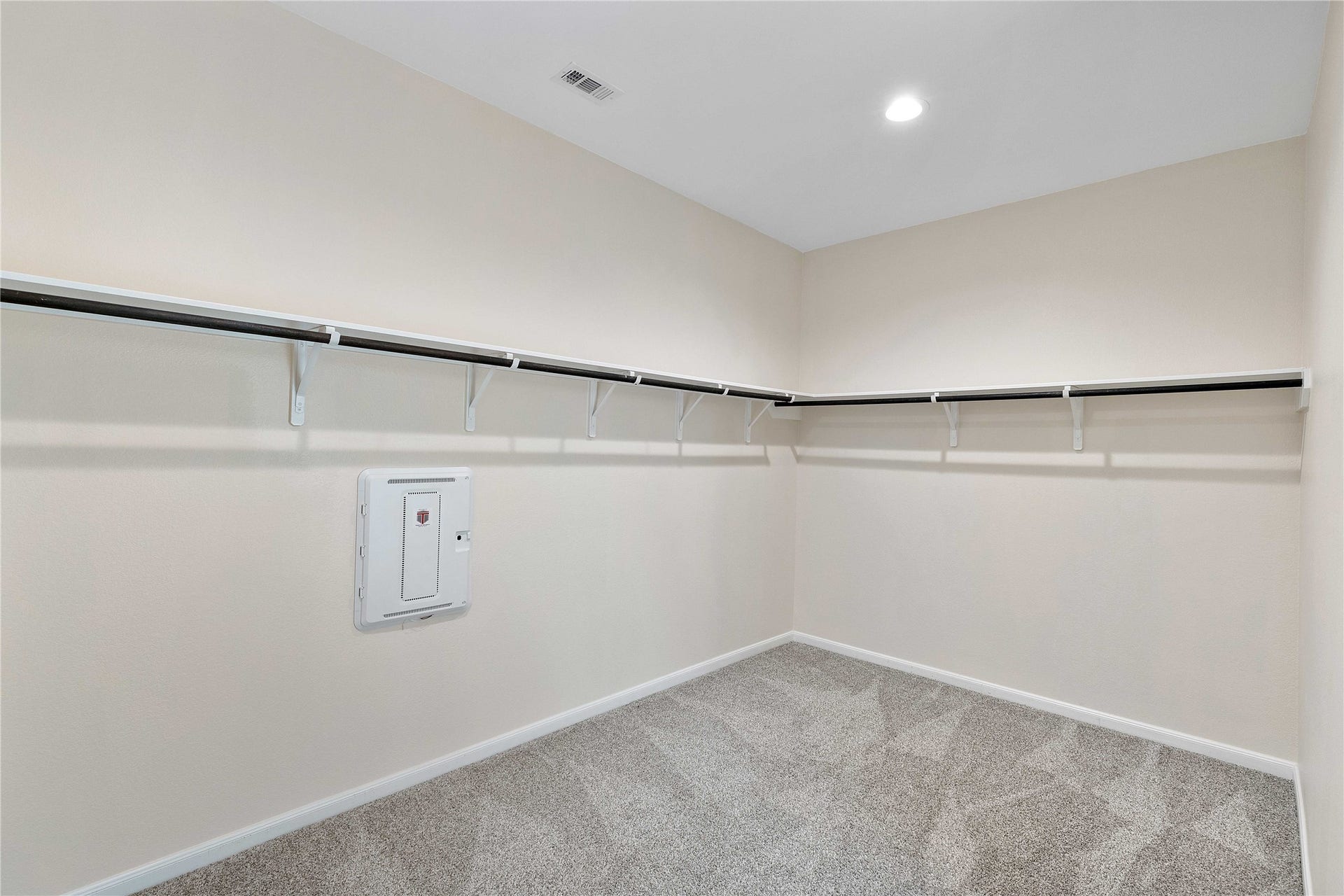 Primary bedroom walk in closet
