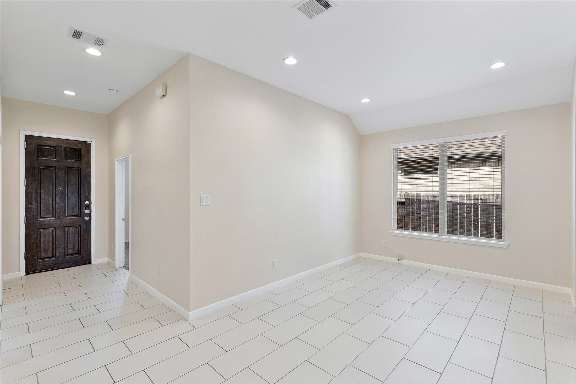 Step into a bright, inviting foyer with seamless flow into an elegant dining area, perfect for entertaining.