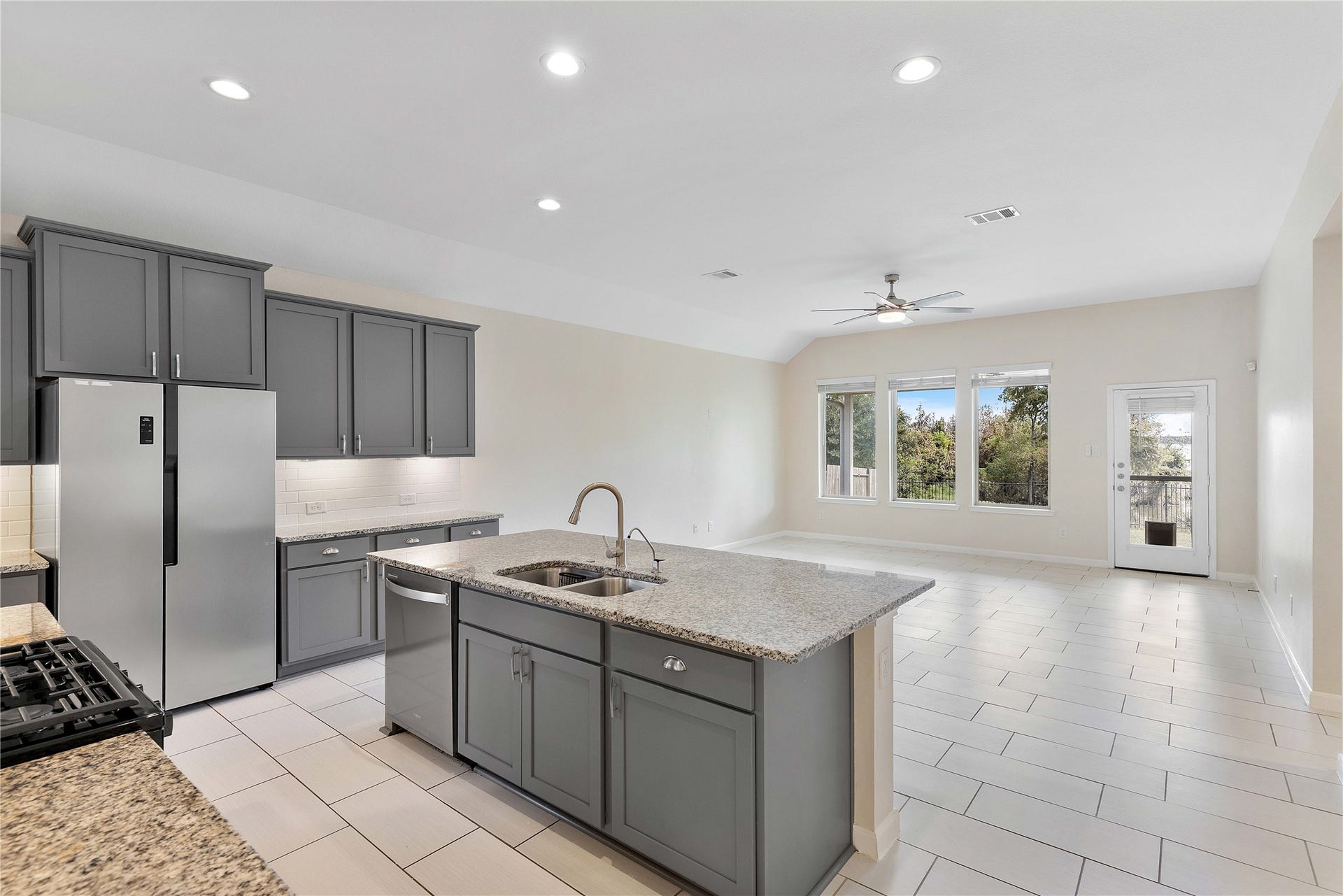Experience seamless living in this modern kitchen that flows effortlessly into a bright, spacious living area, perfect for entertaining and everyday comfort.