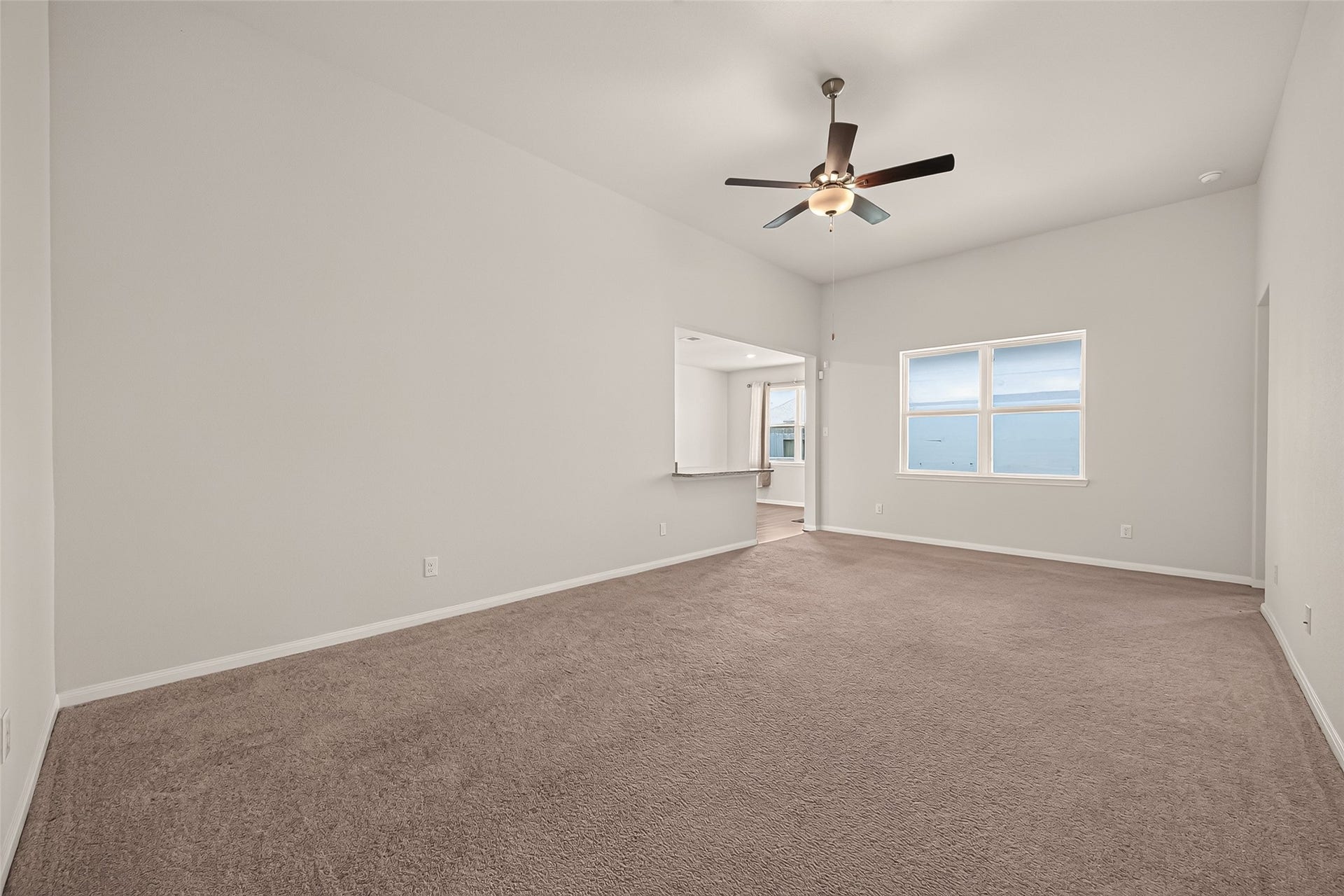 3205 Foresail Lane, Santa Fe, TX 77510 Another view of the family room and how it opens to the kitchen.