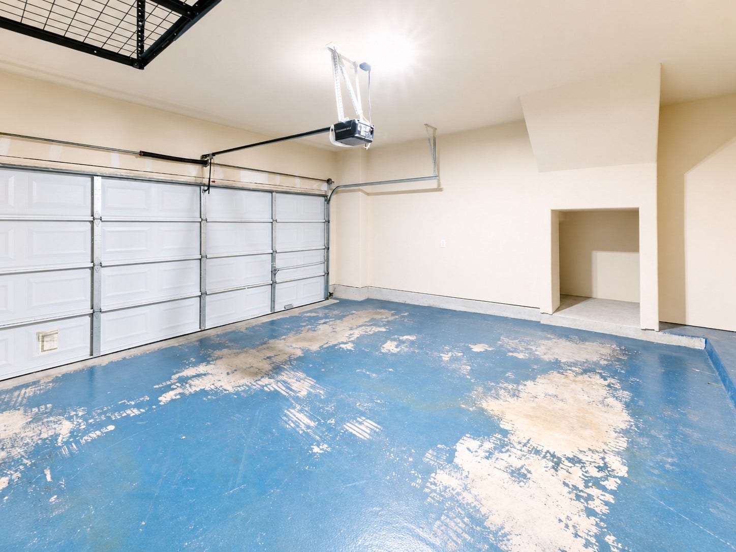 1710 Aden Mist Drive, Houston, TX 77003 Spacious garage featuring a double door with automatic opener, high ceilings, and a versatile storage nook, perfect for parking or projects.