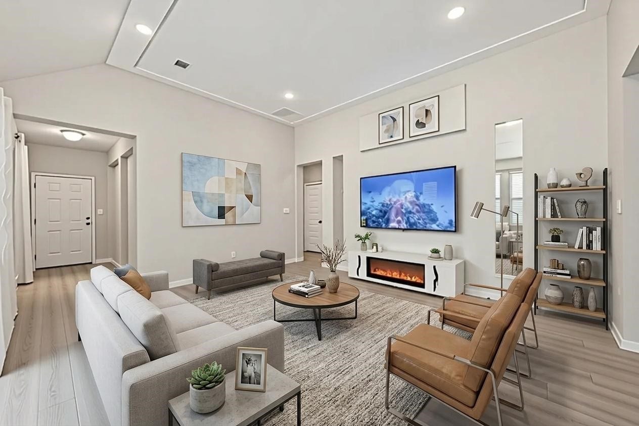 22409 Kinley Street, New Caney, TX 77357 Experience the inviting elegance of this digitally staged living room, featuring modern furnishings, a sleek fireplace, and a soothing neutral paletteperfect for envisioning your dream home.