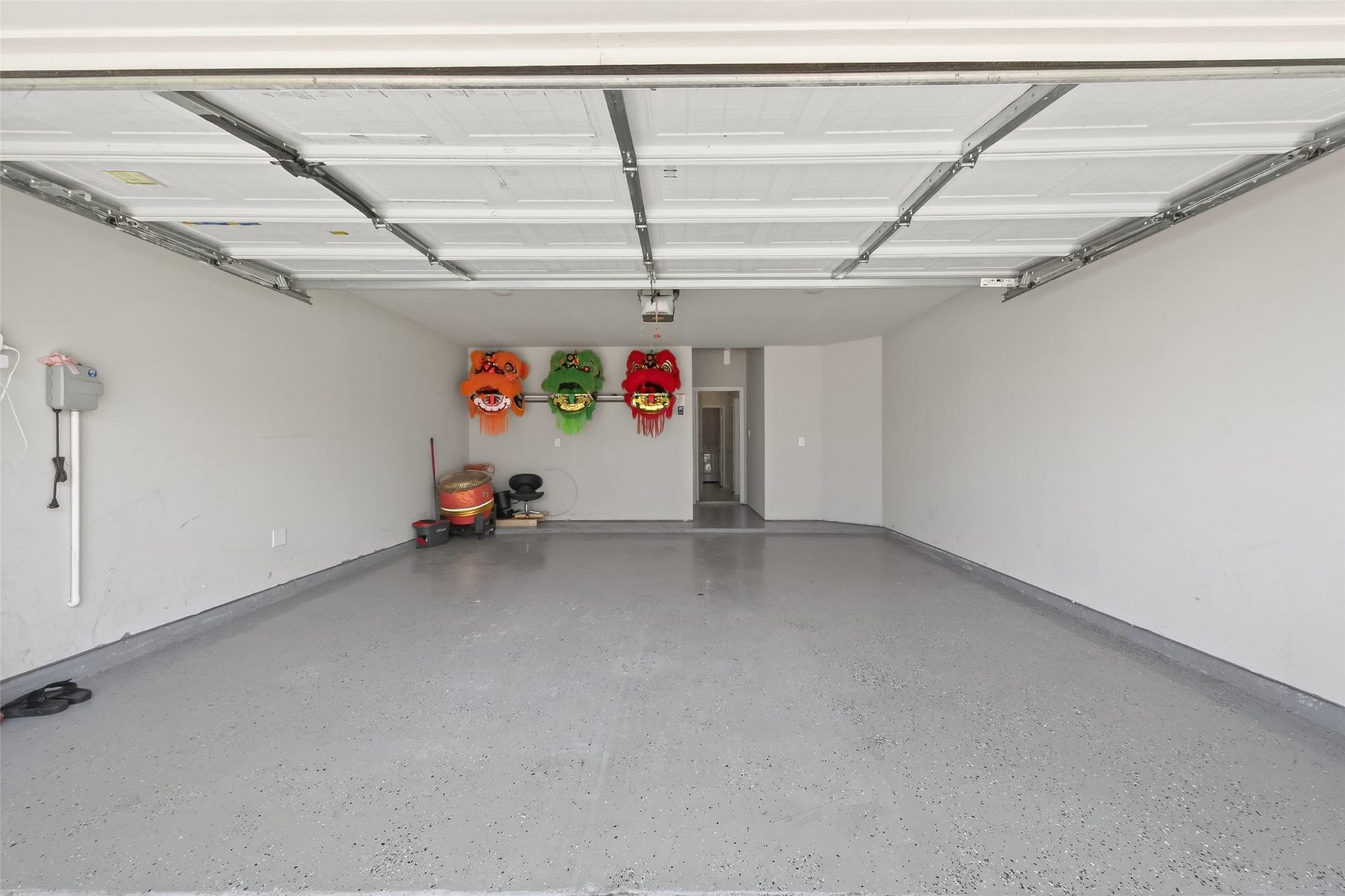 22409 Kinley Street, New Caney, TX 77357 Spacious two-car garage with a clean, polished concrete floor and ample storage space.