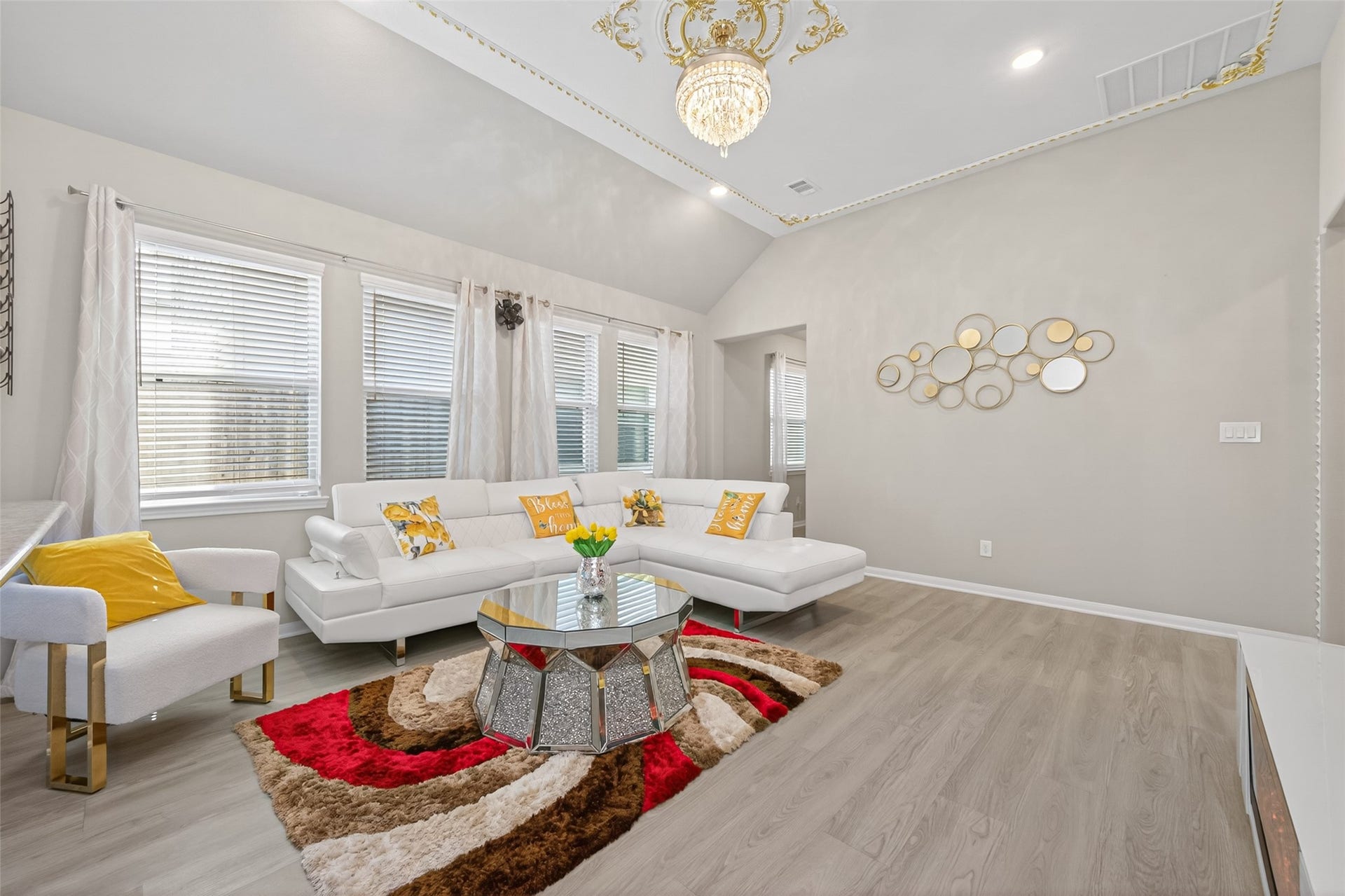 22409 Kinley Street, New Caney, TX 77357 This living room features a modern design with high ceilings and elegant crown molding.