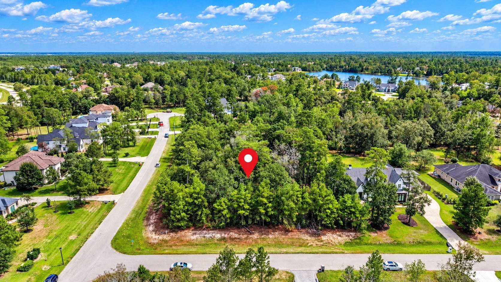 Aerial view highlighting the property's mature trees and desirable corner location.