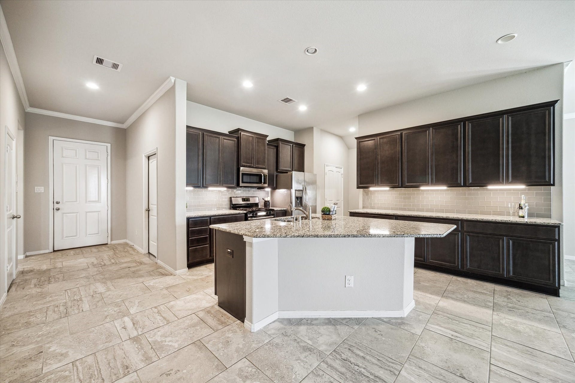 6610 Auburn Terrace Lane, Rosenberg, TX 77471 Look at this beautiful kitchen! View of the kitchen from the living area with tile floors.
