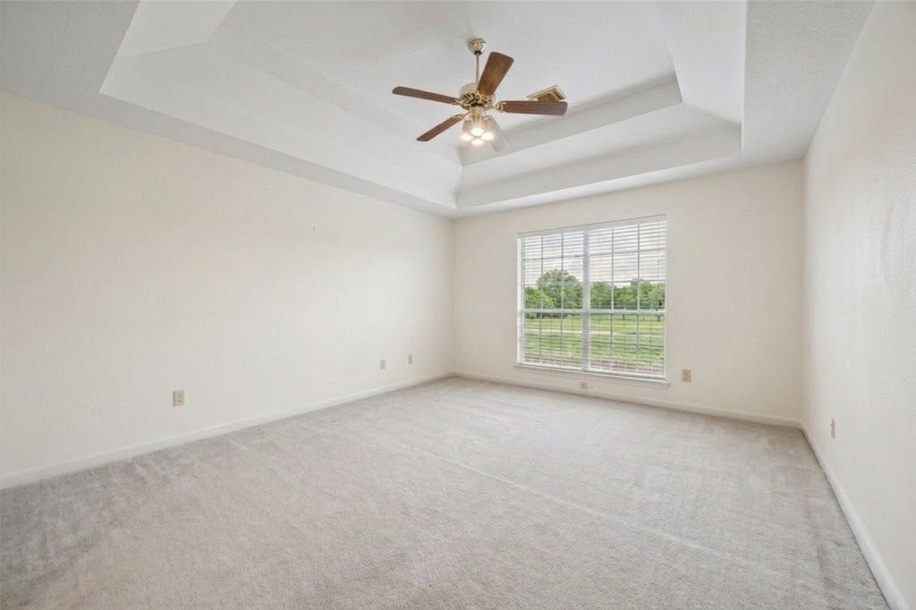 The over bedroom with tray ceiling on the other side of the Hollywood bathrooom.