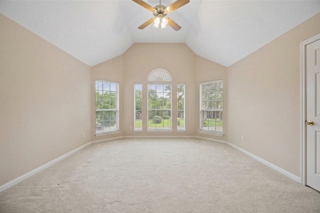 Upstairs bedroom with vaulted ceiling on one side of the Hollywood bathroom.