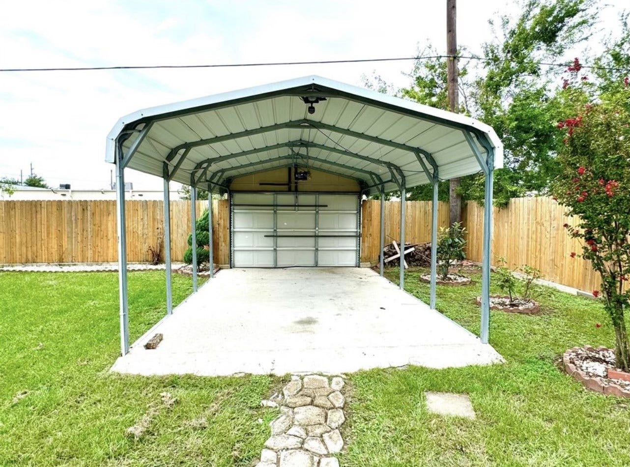 20319 Mountaindale Drive, Cypress, TX 77433 There is also a covered driveway with a garage door ini the backyard which is connected to the parking lot behind the home.