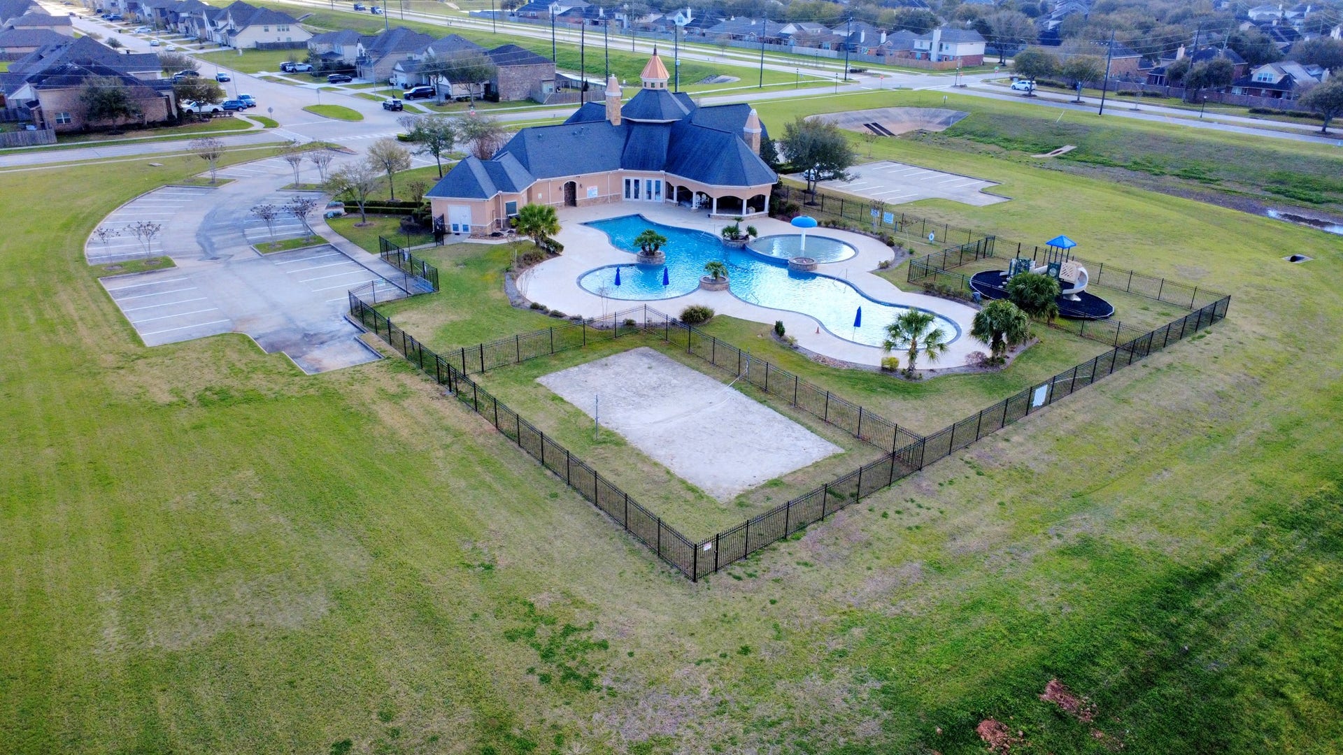 6226 Mason Way, Rosenberg, TX 77471 Community clubhouse, pool, volleyball area, and playground amenities