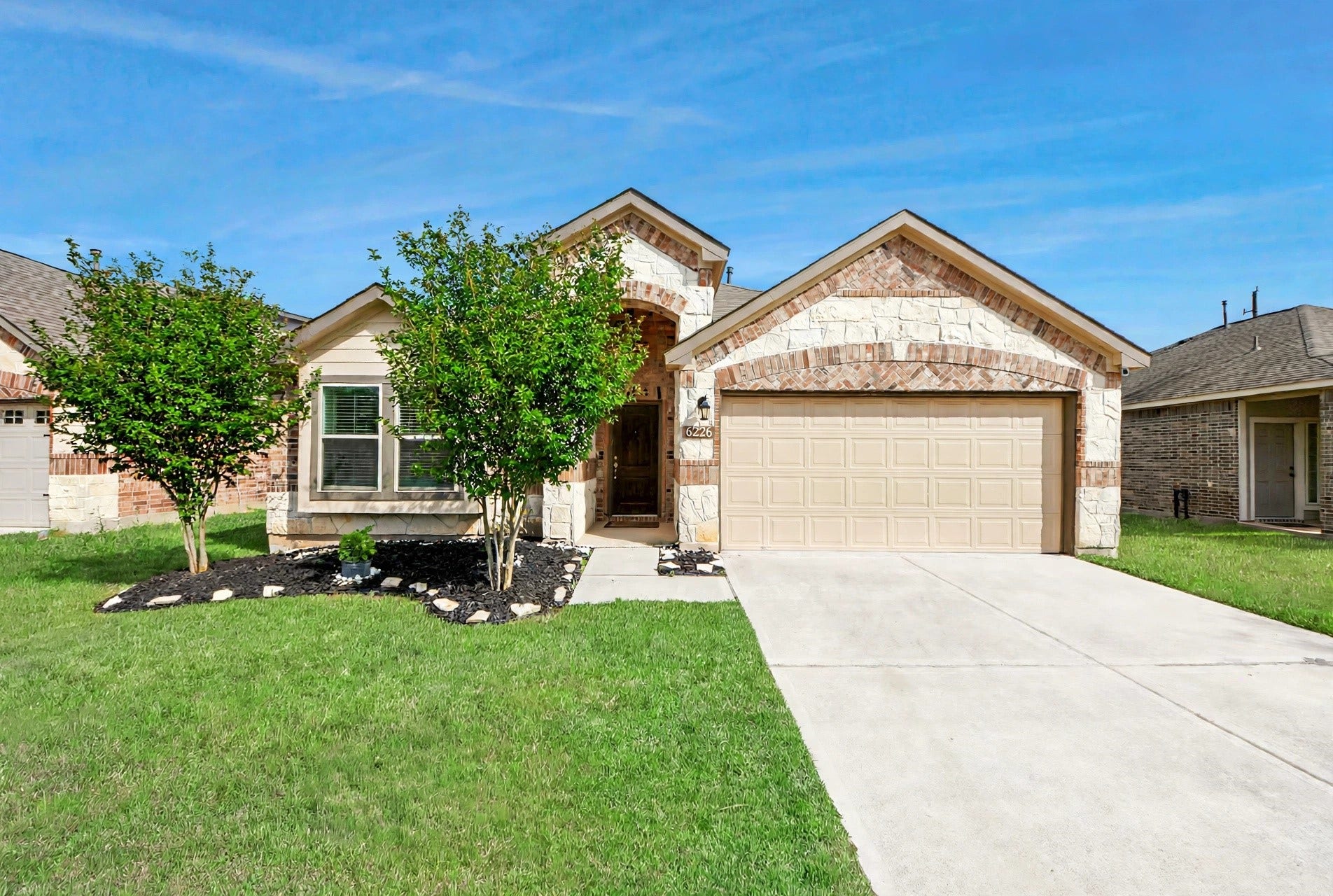 6226 Mason Way, Rosenberg, TX 77471 Front view of home showing brick and stone elevation