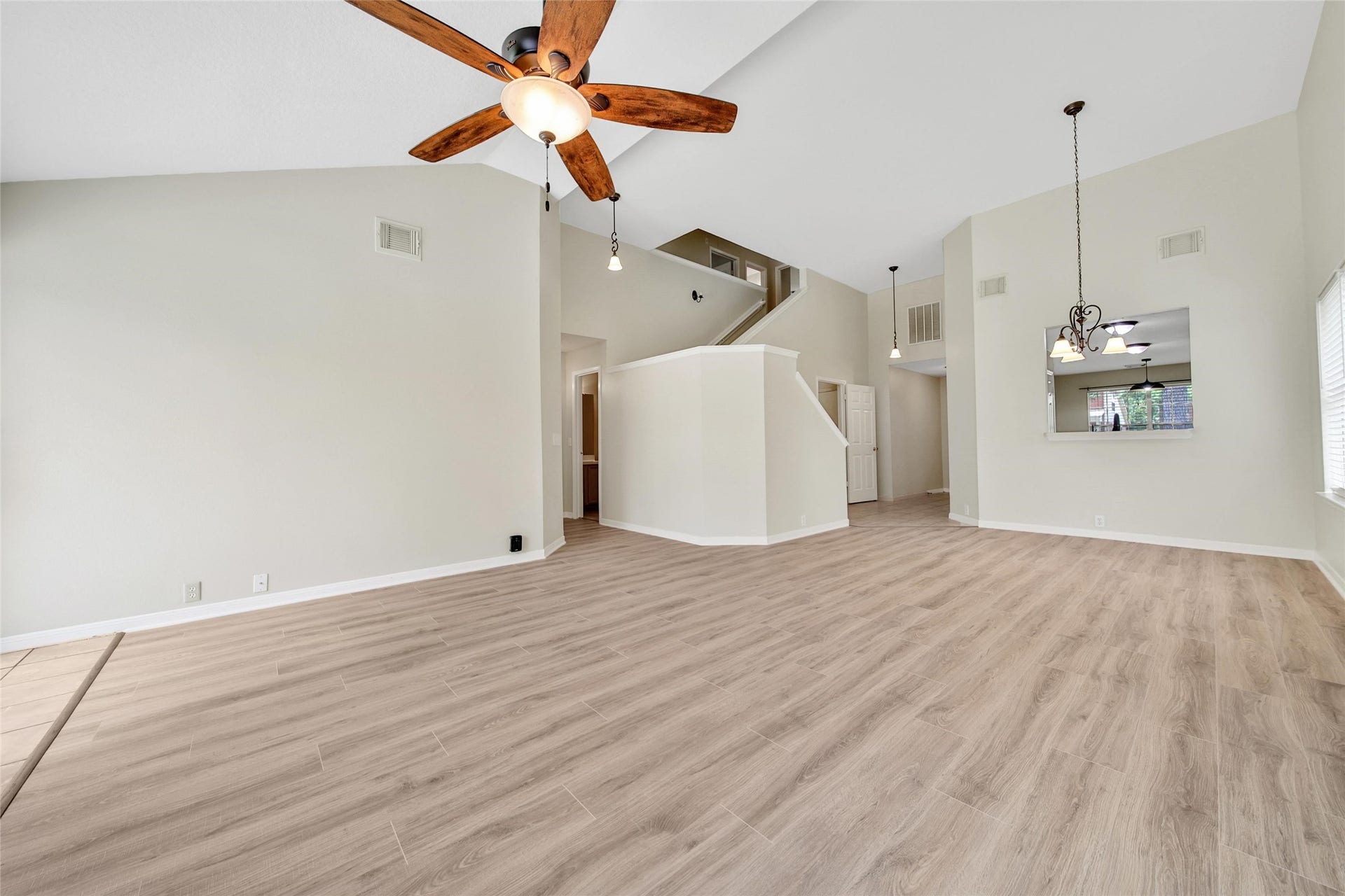 11911 Ezekiel Drive, Tomball, TX 77375 Spacious family room with high ceilings and plenty of space for gatherings.