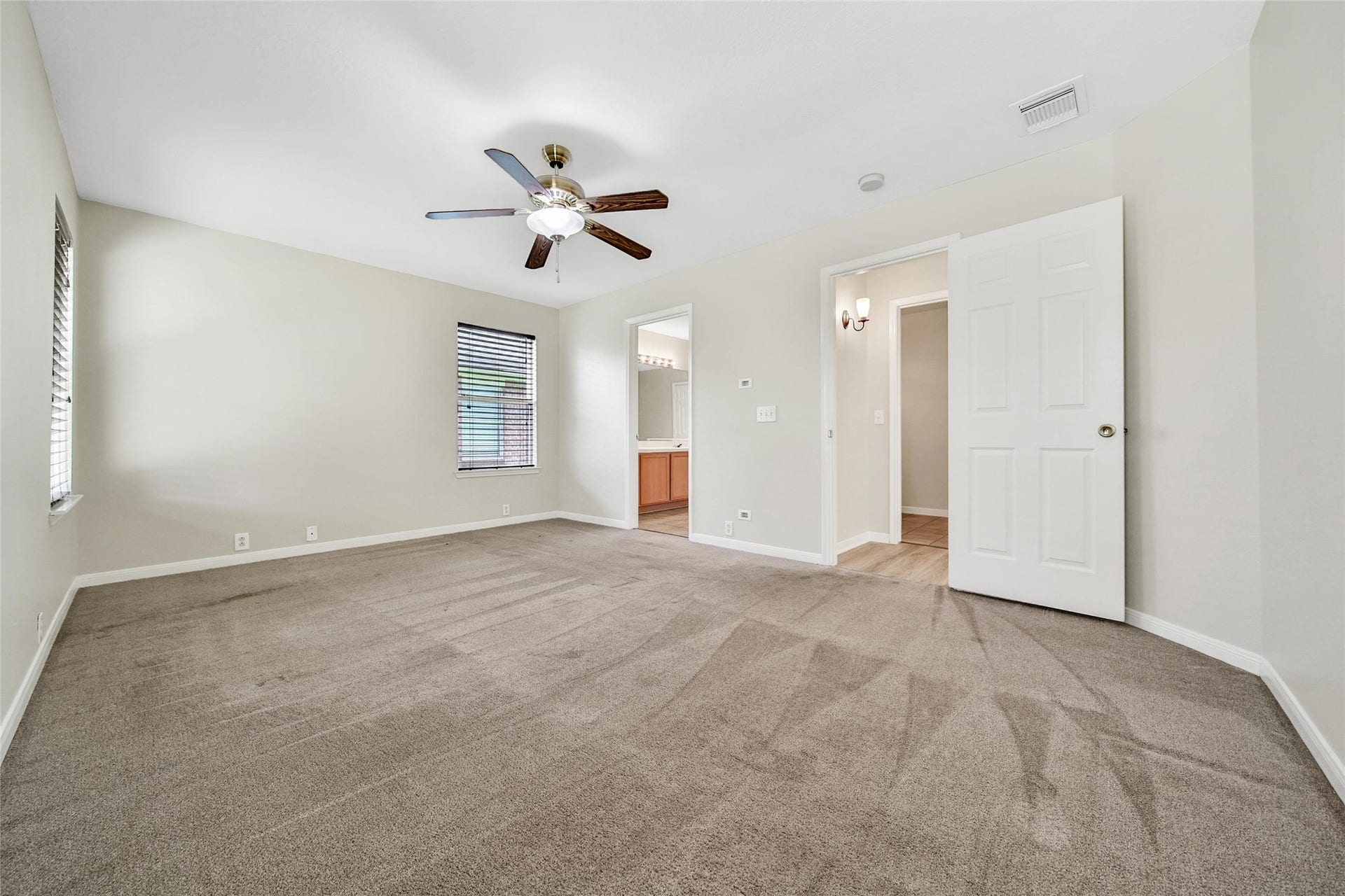 11911 Ezekiel Drive, Tomball, TX 77375 Primary bedroom with ensuite bathroom.